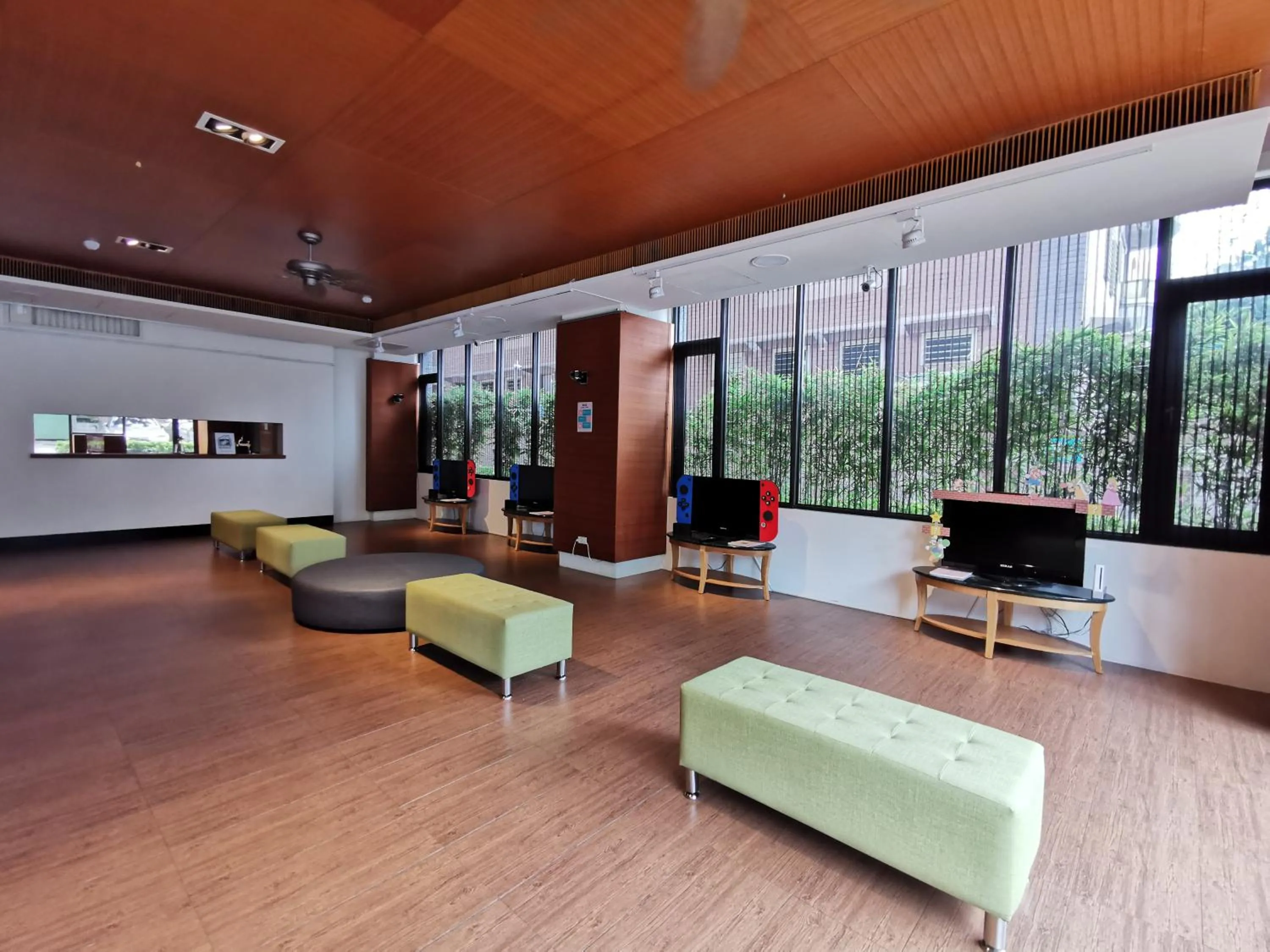 Communal lounge/ TV room in Azure Hotel