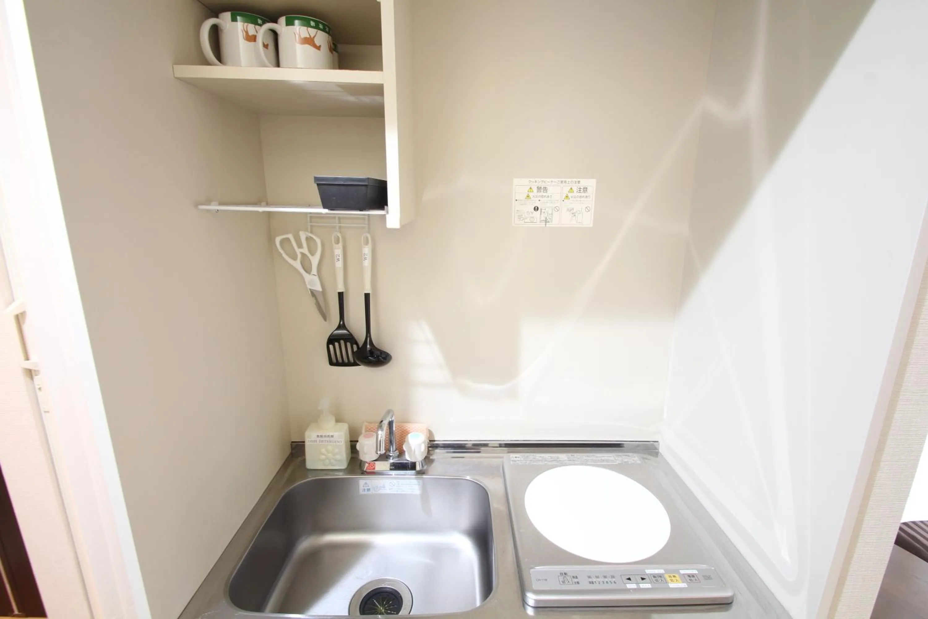 Kitchen or kitchenette in Sakura Hotel Hatagaya