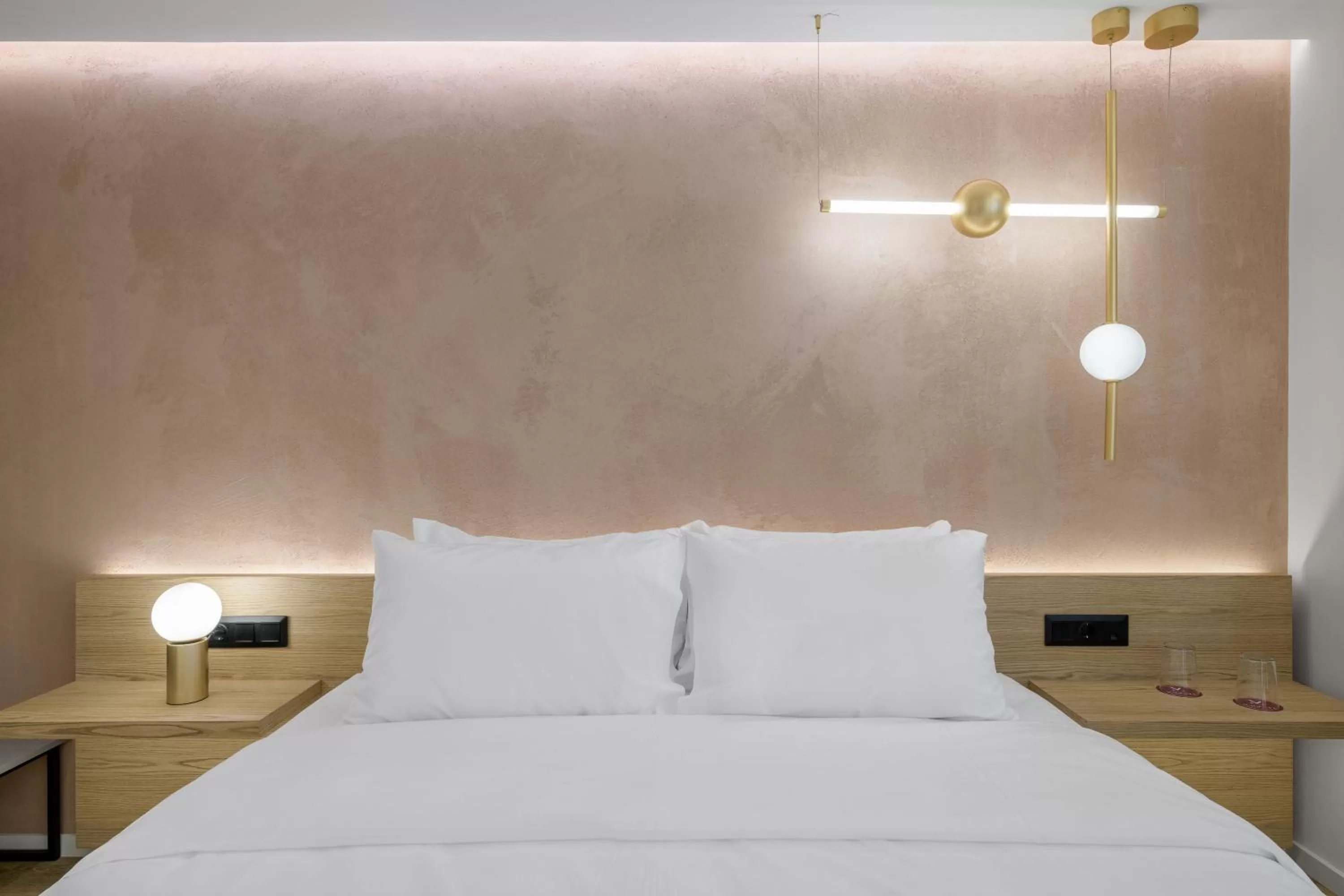 Bed in Acropolis Magenta Luxury Suites