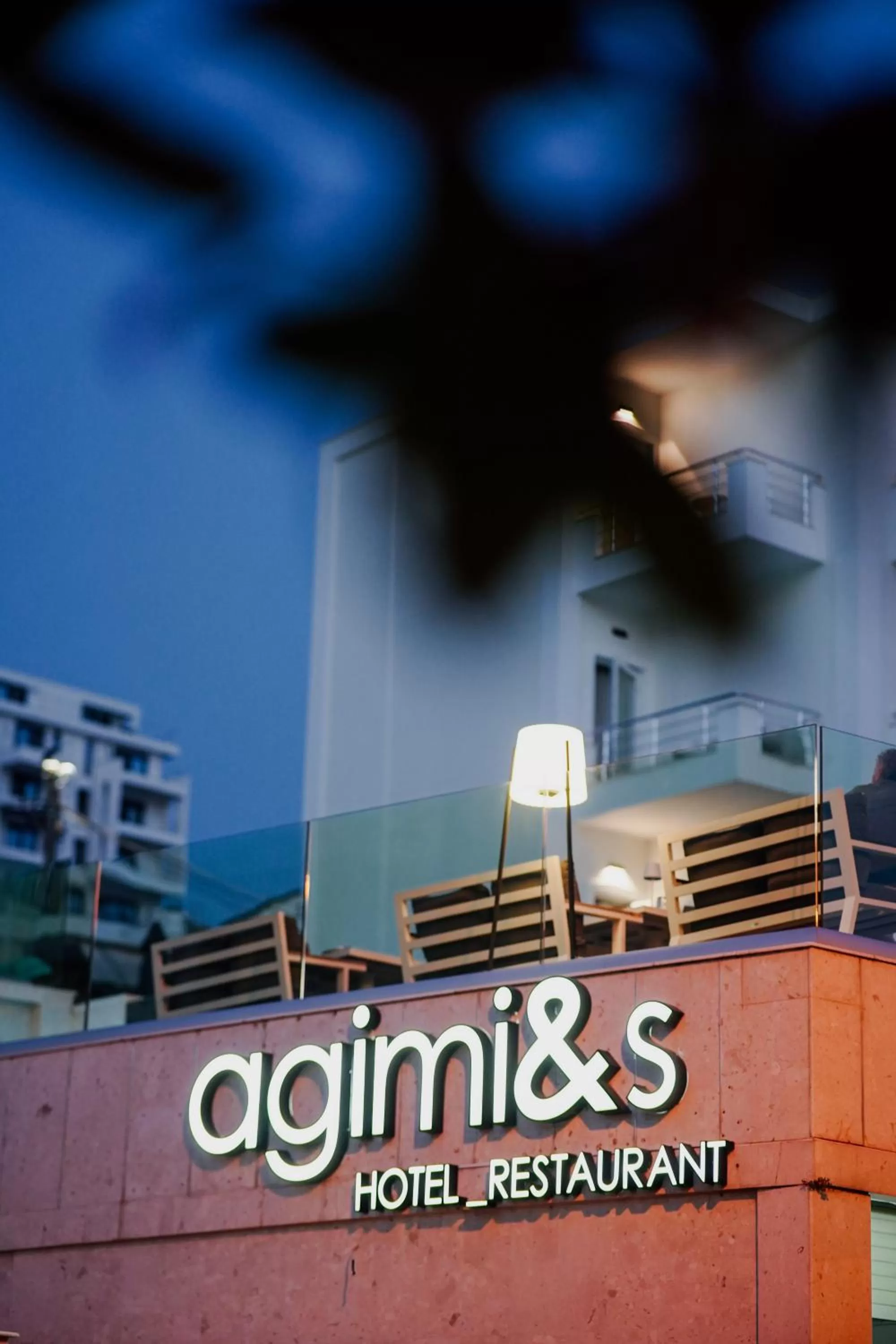 Property logo or sign in Hotel Agimi