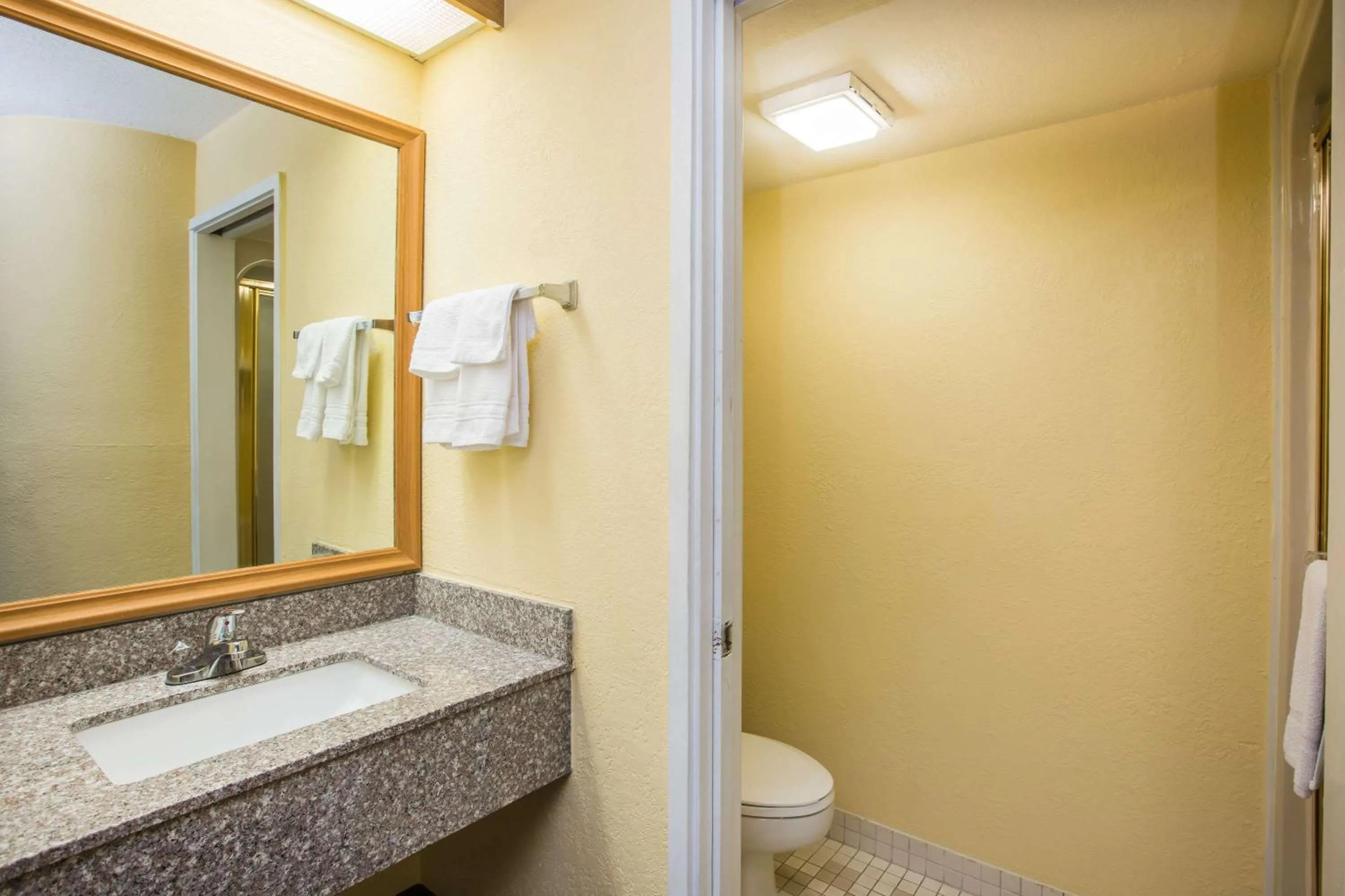 Bathroom in Days Inn by Wyndham Blue Springs