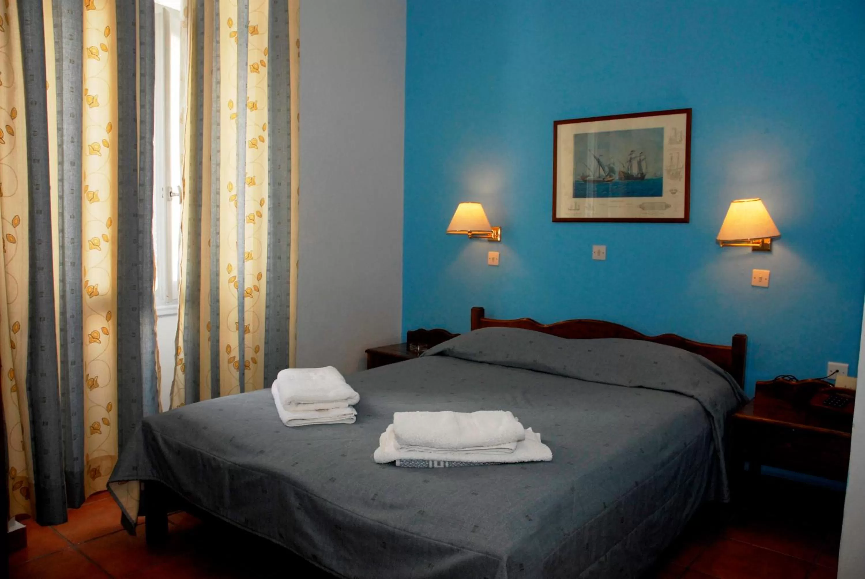 Bed in Amaryllis Hotel