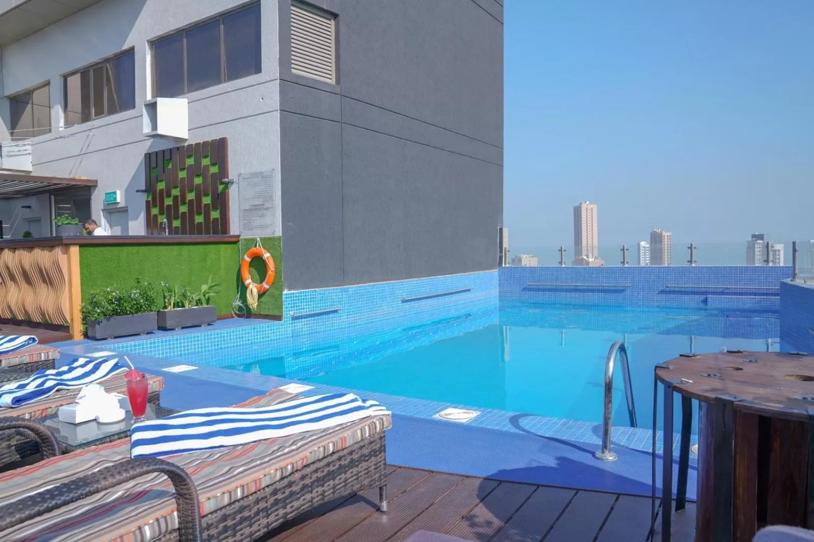 Swimming pool in Ramada Encore by Wyndham Kuwait Downtown