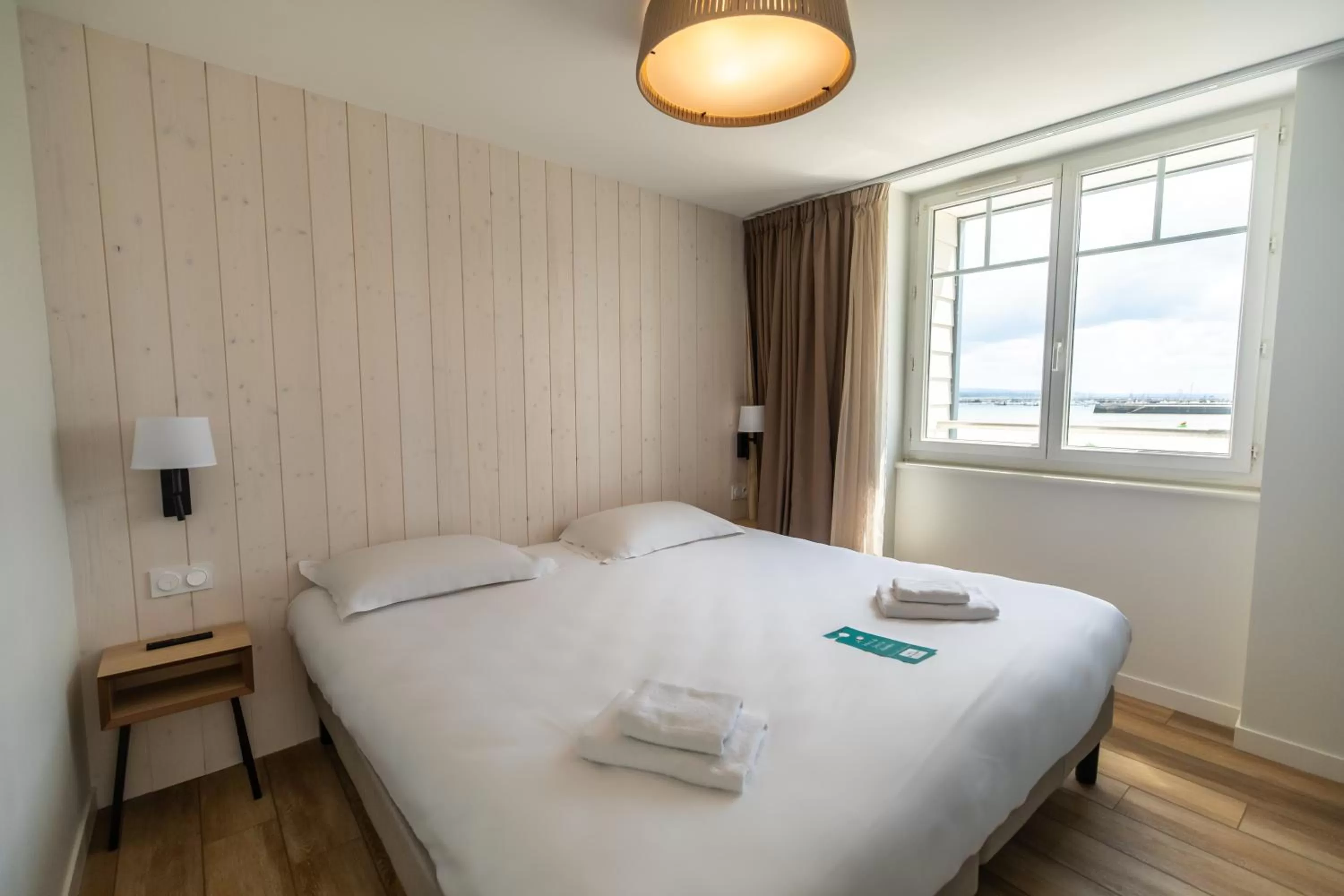 Bed in Hôtel de la Baie