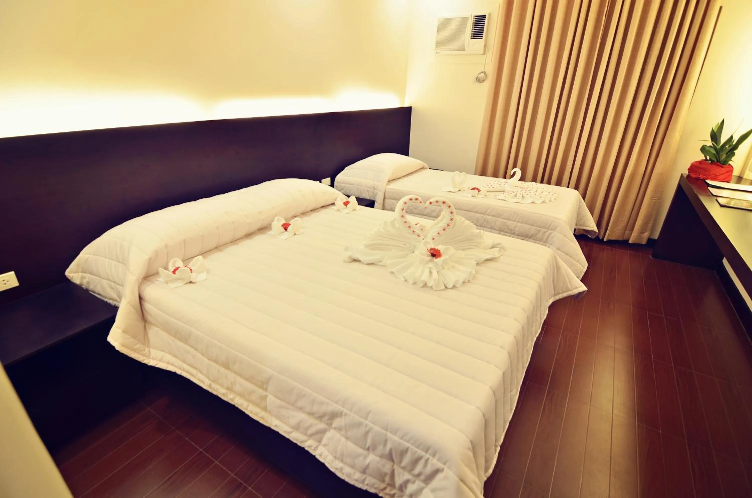 Bed in Citystate Asturias Hotel Palawan