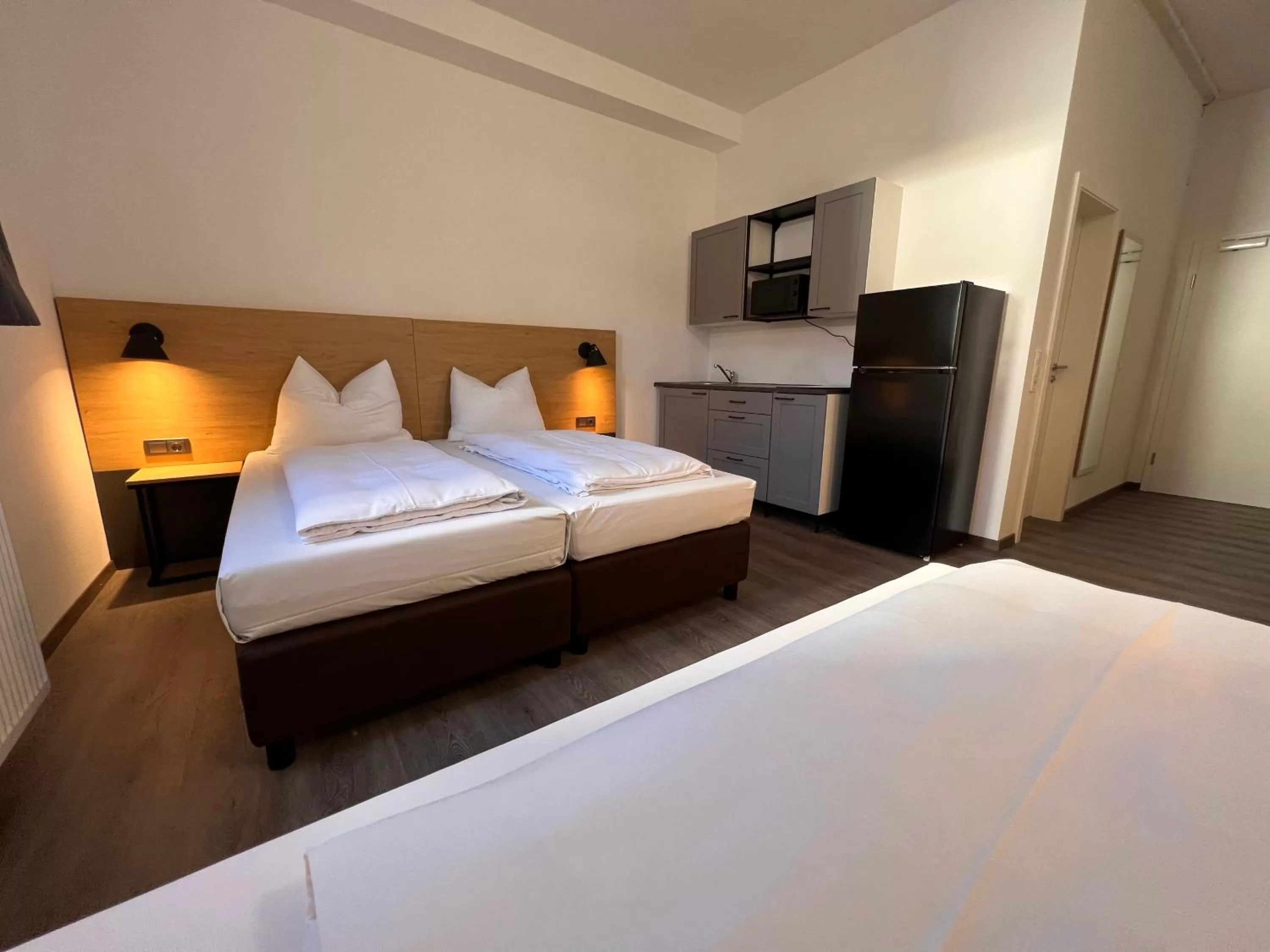 kitchen, Bed in 24seven Apartments - Self Check-IN