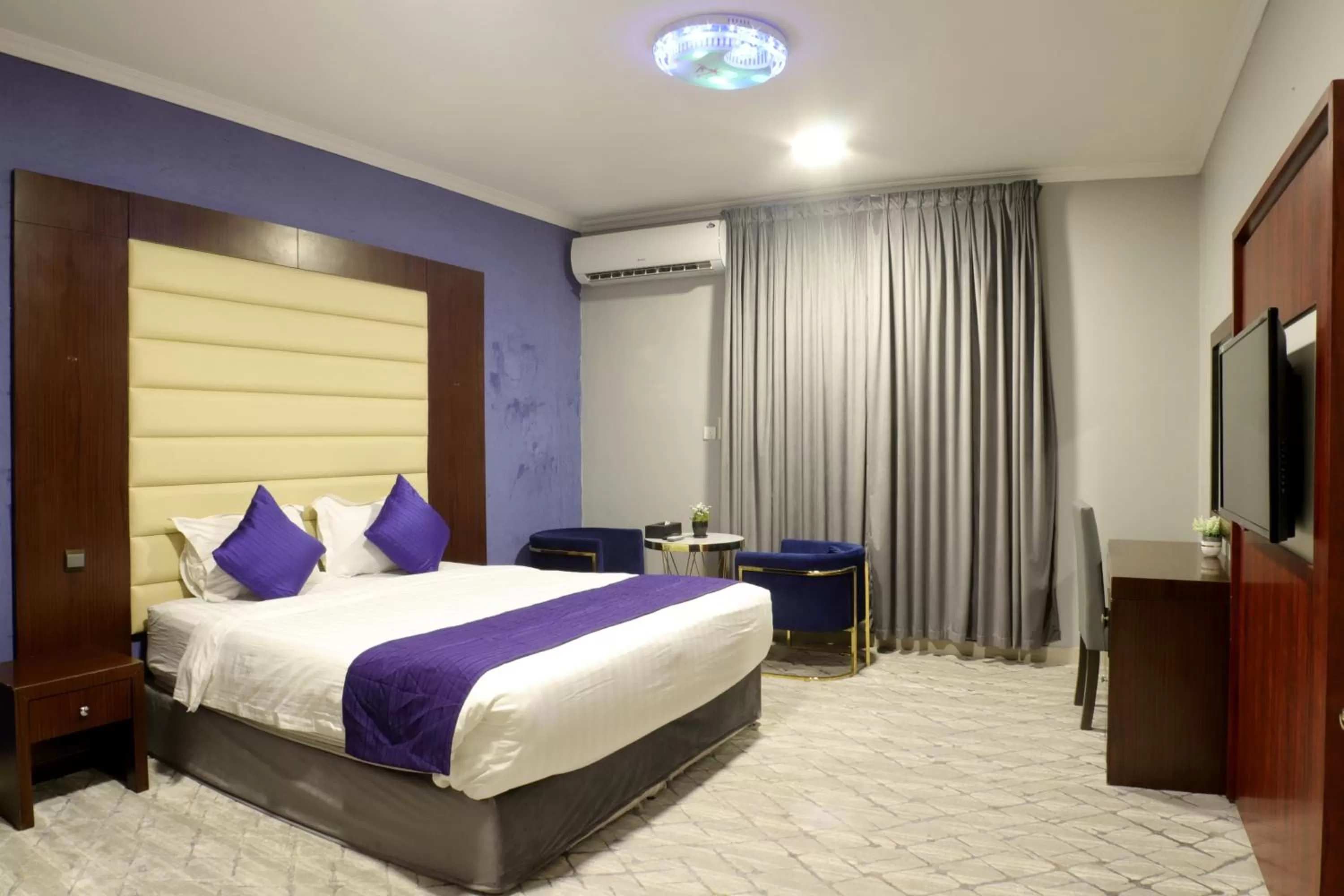 Bed in Maskan Al Dyafah Hotel Apartments