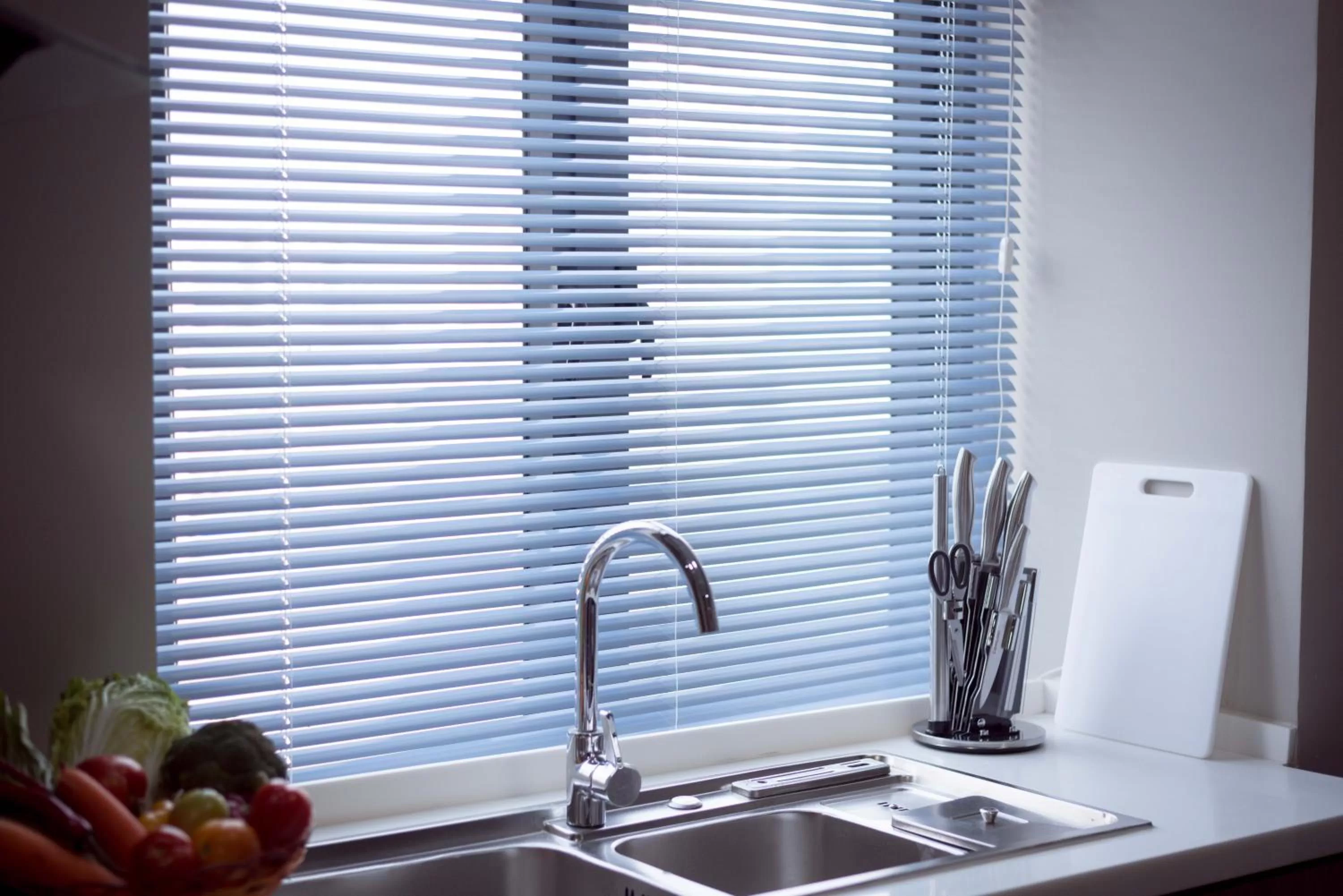 Kitchen or kitchenette in SOHO Residence