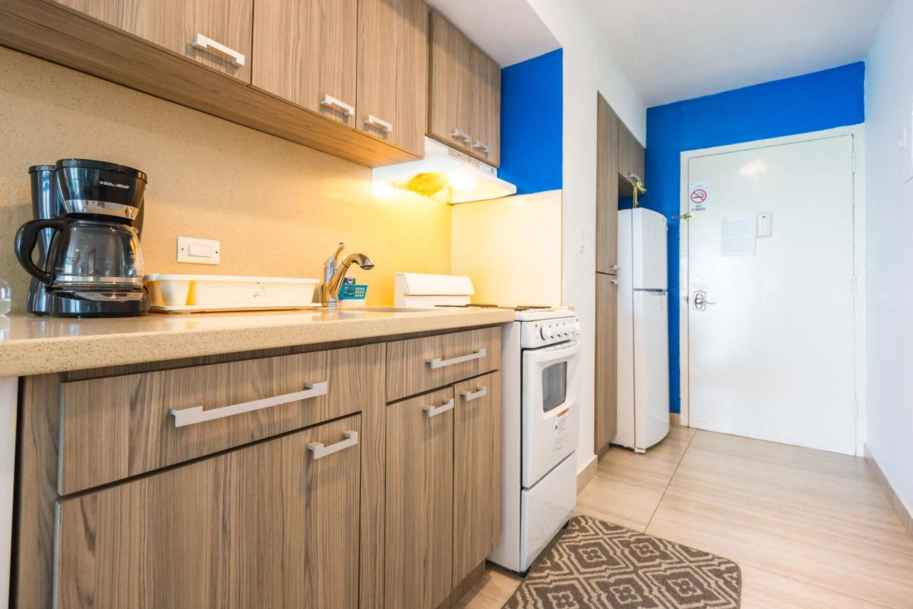 Coffee/tea facilities in ESJ Towers by Chana