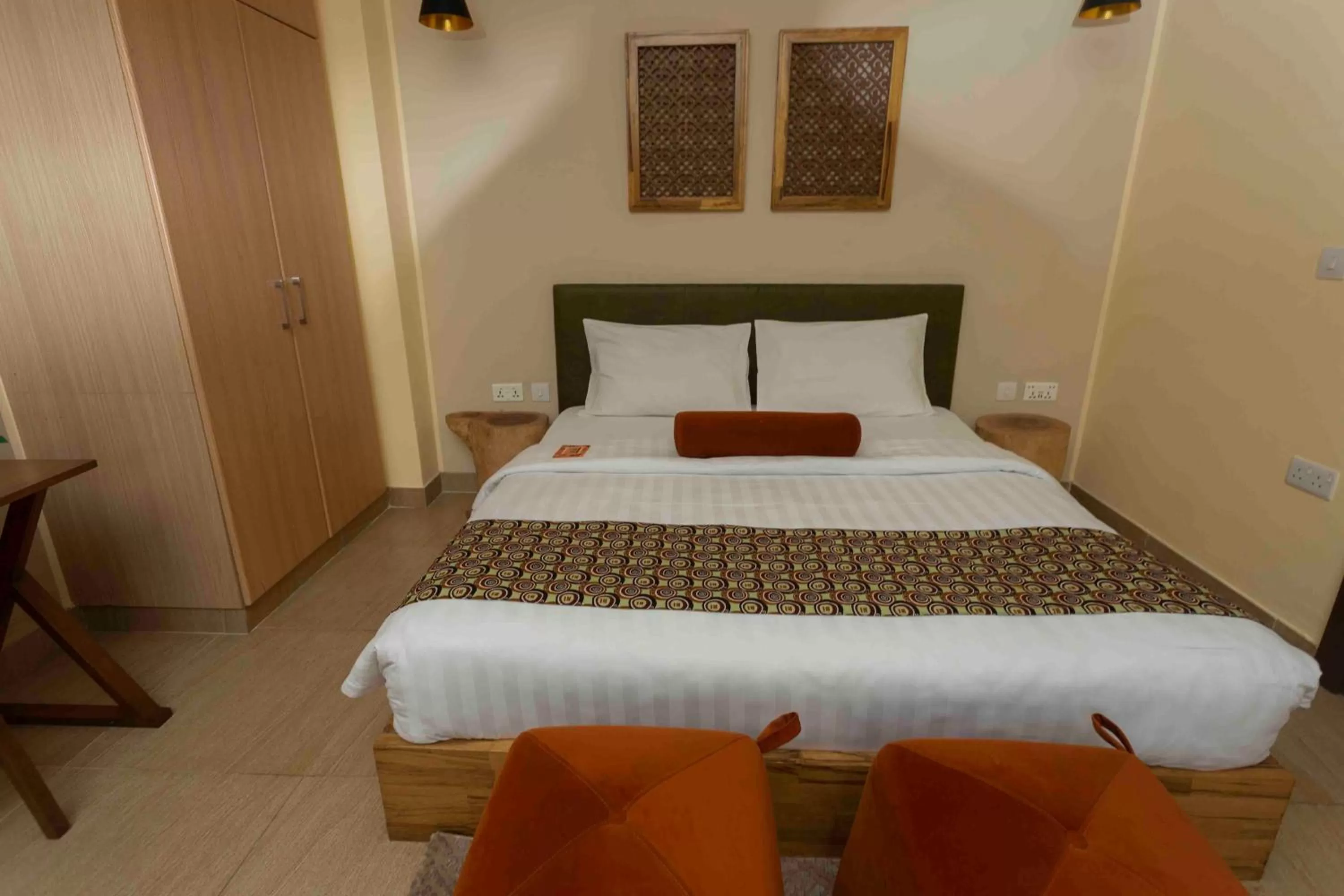 Bed in Roots Hotel Apartment