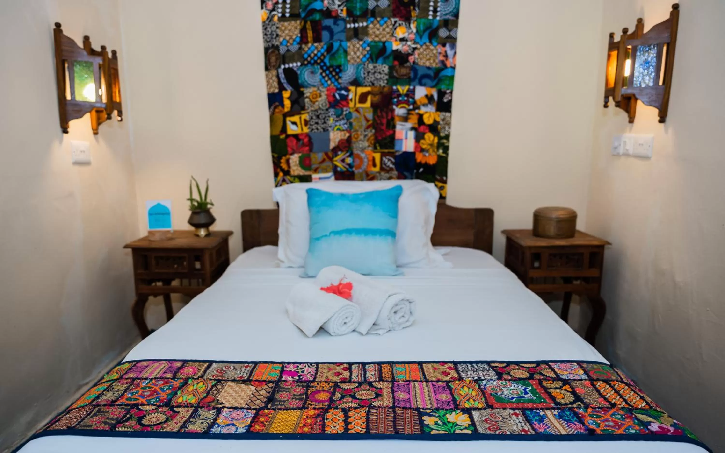 Bed in Emerald Palm Boutique Hotel