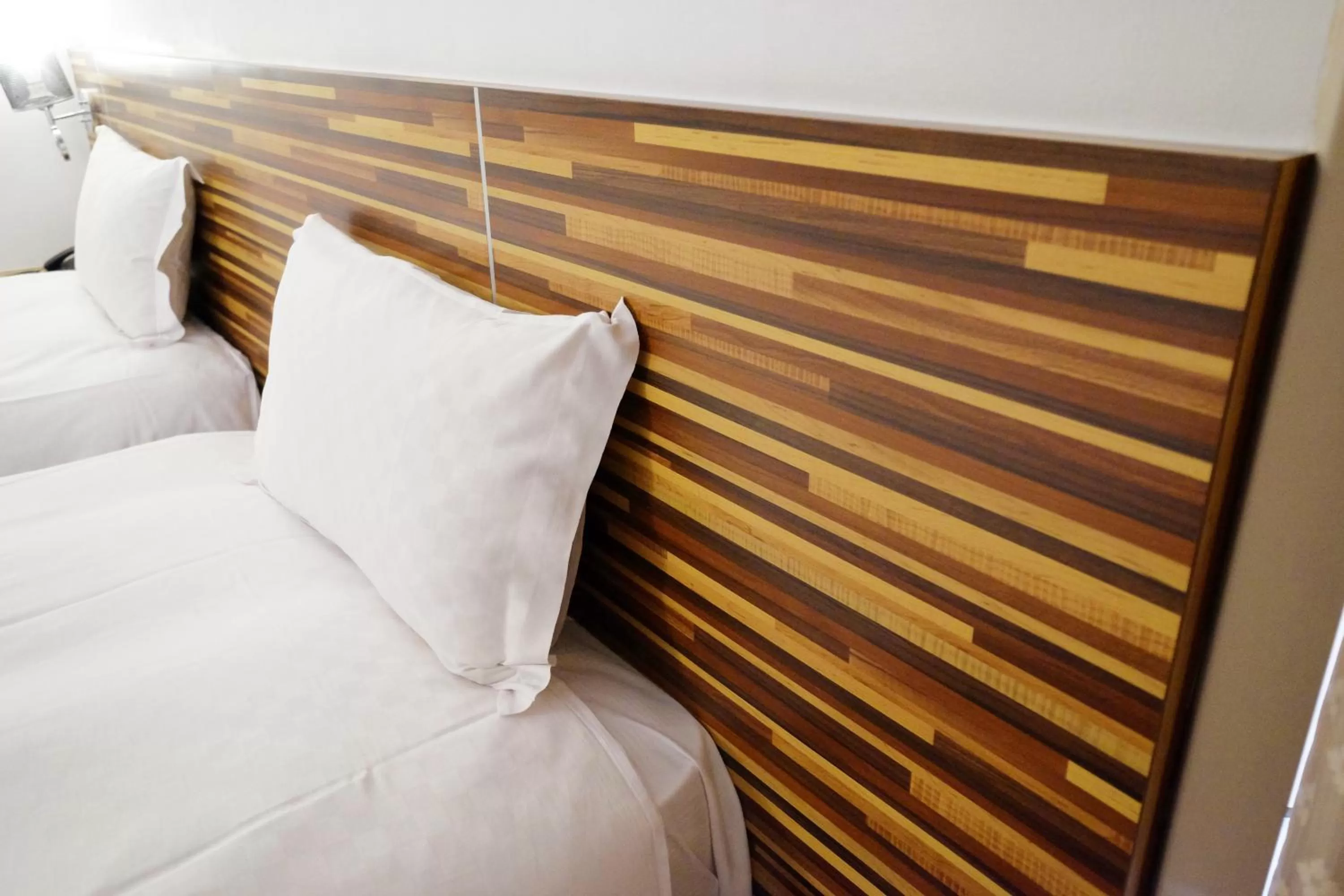 Bed in Dynasty Hotel