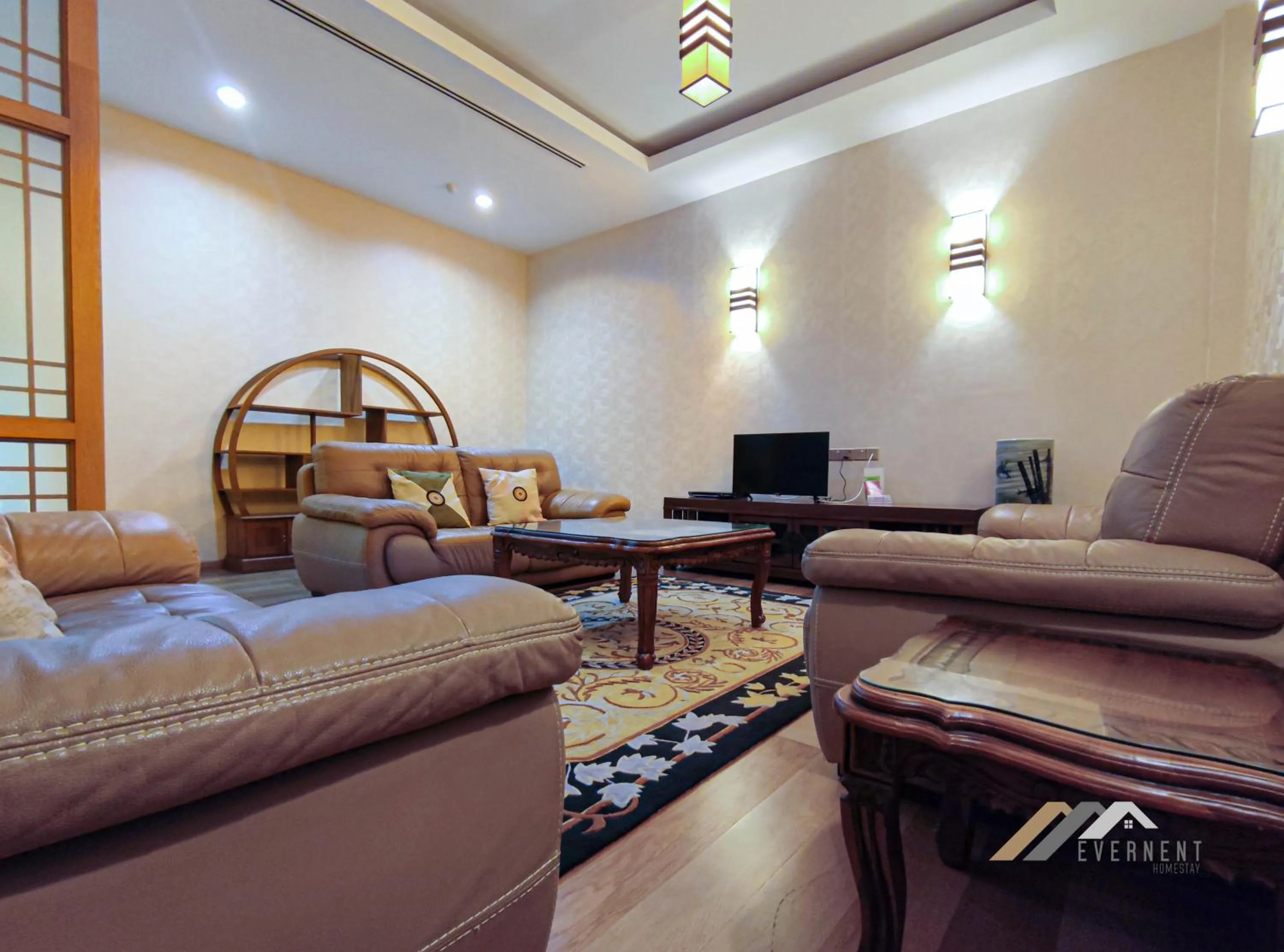 Living room in Mciti Suites by Evernent