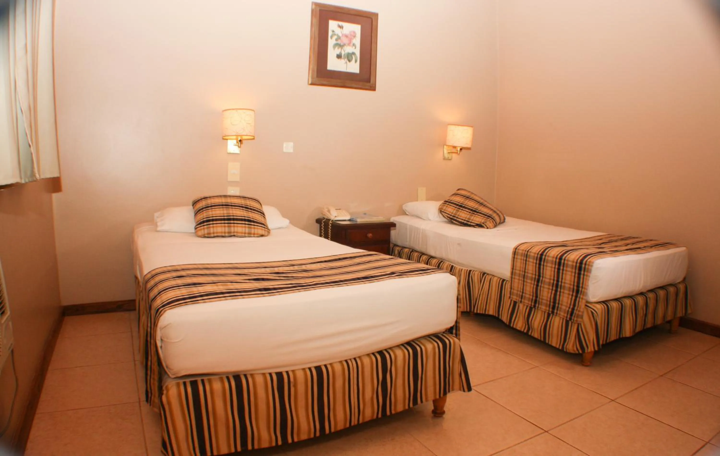 Bed in Marcopolo Suites Iguazu