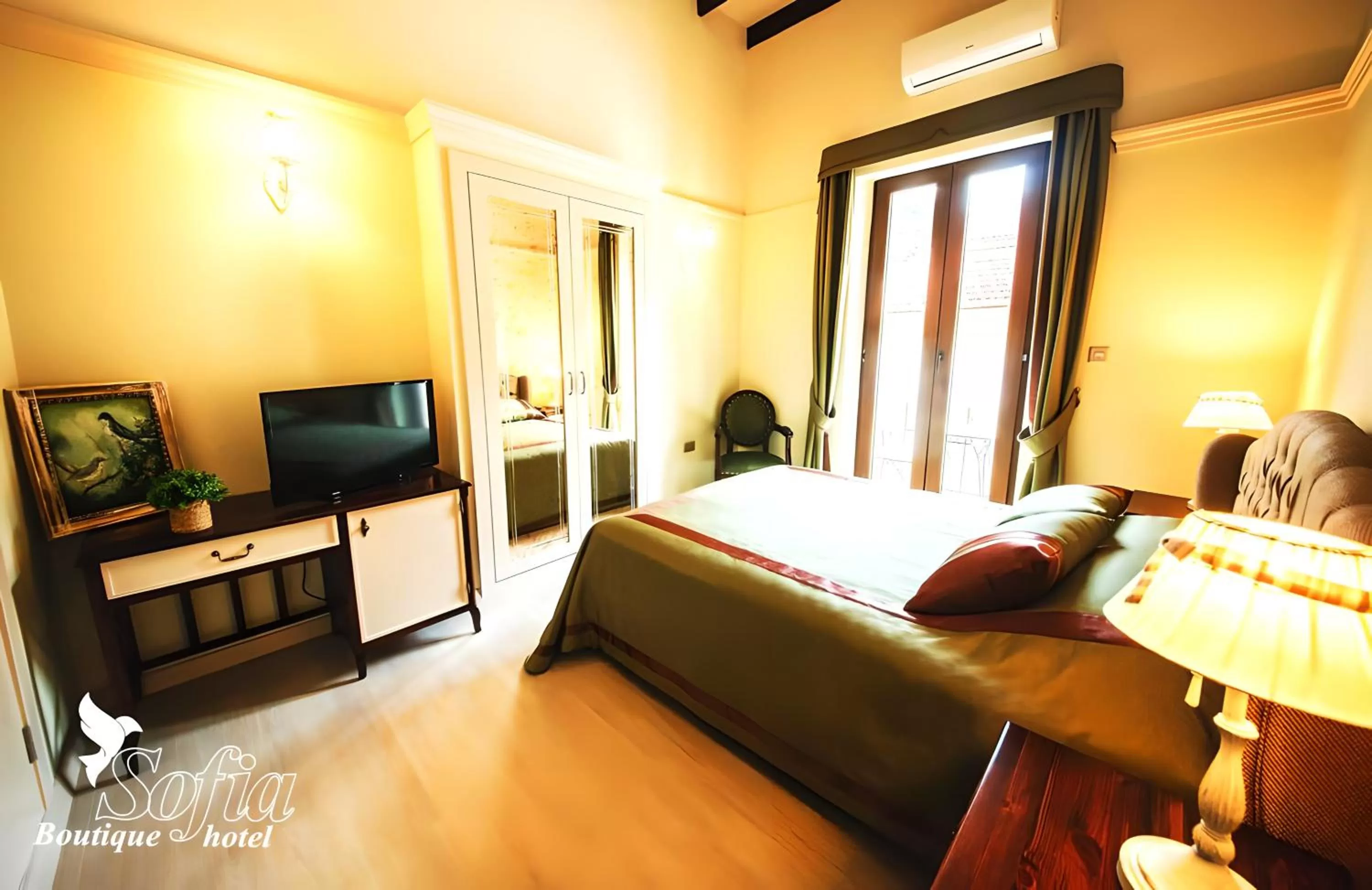 Communal lounge/ TV room, Bed in SOFIA BOUTIQUE HOTEL