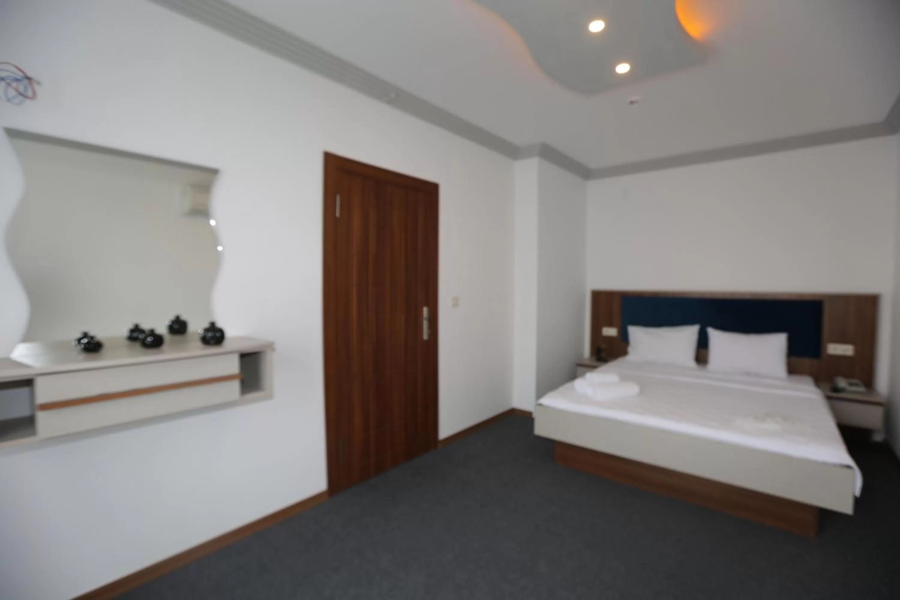 Bed in TEVETOGLU HOTEL