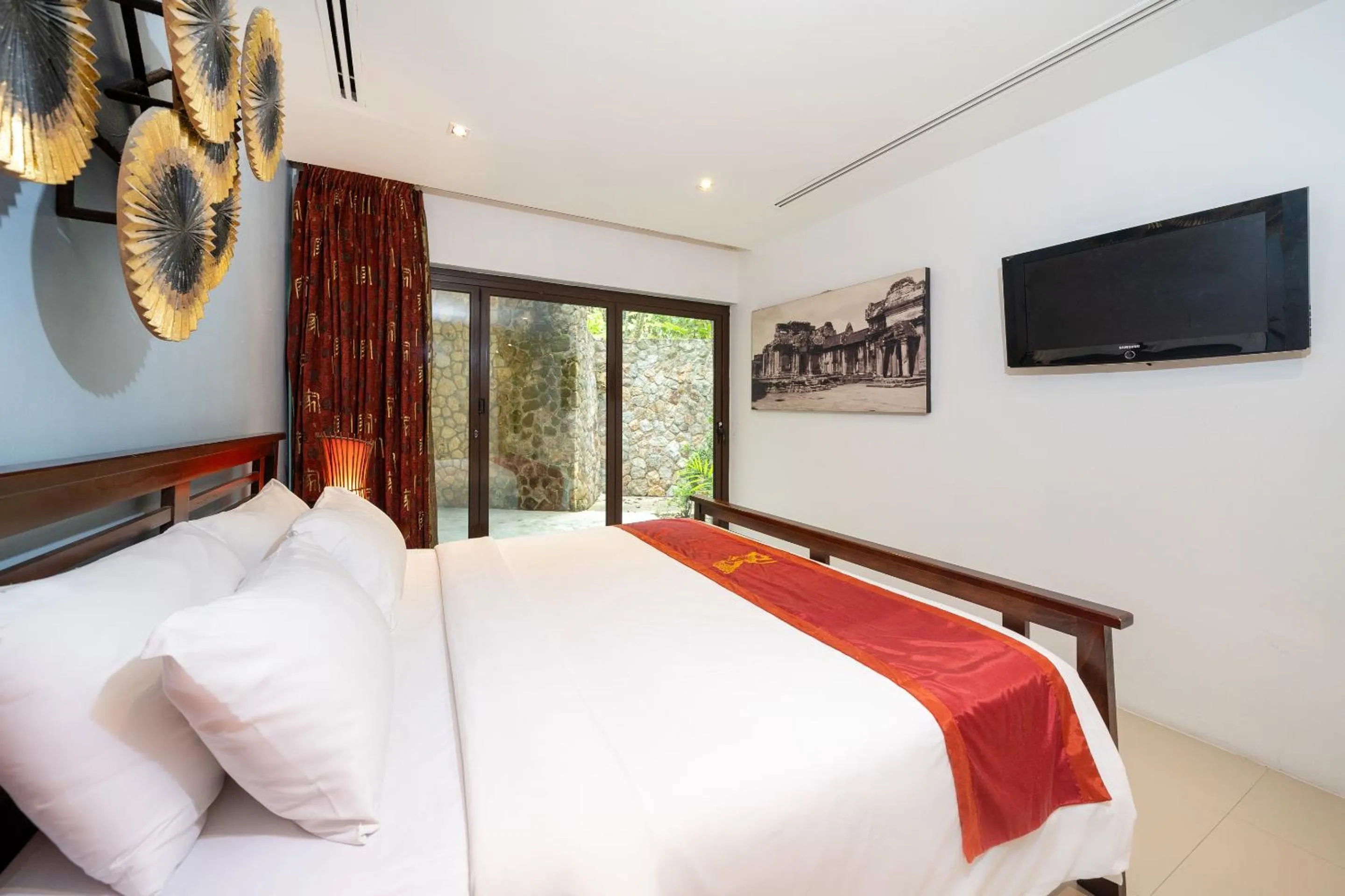 Bedroom, Bed in IndoChine Resort and Villas