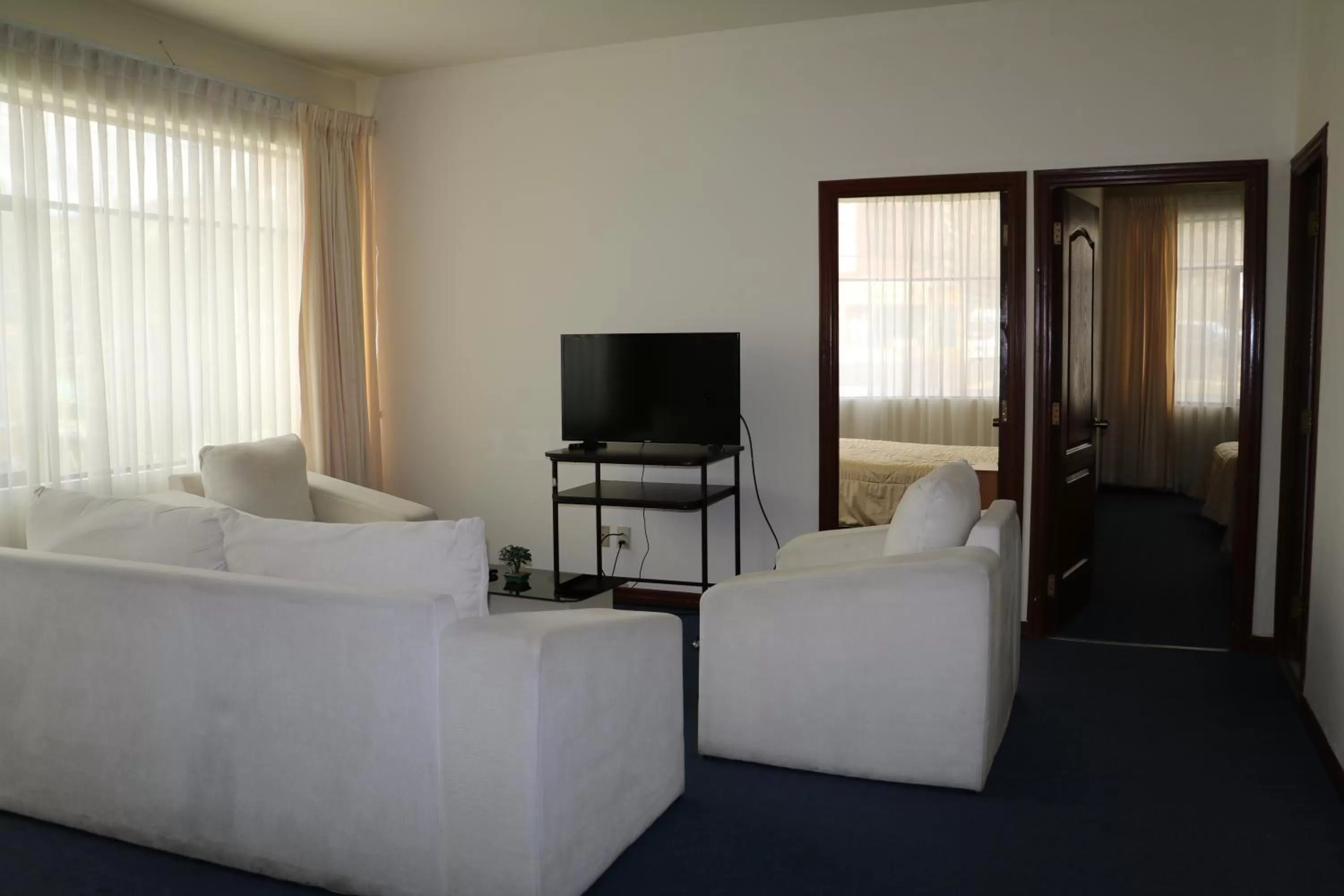 Living room, Bed in Delfines Apart Hotel