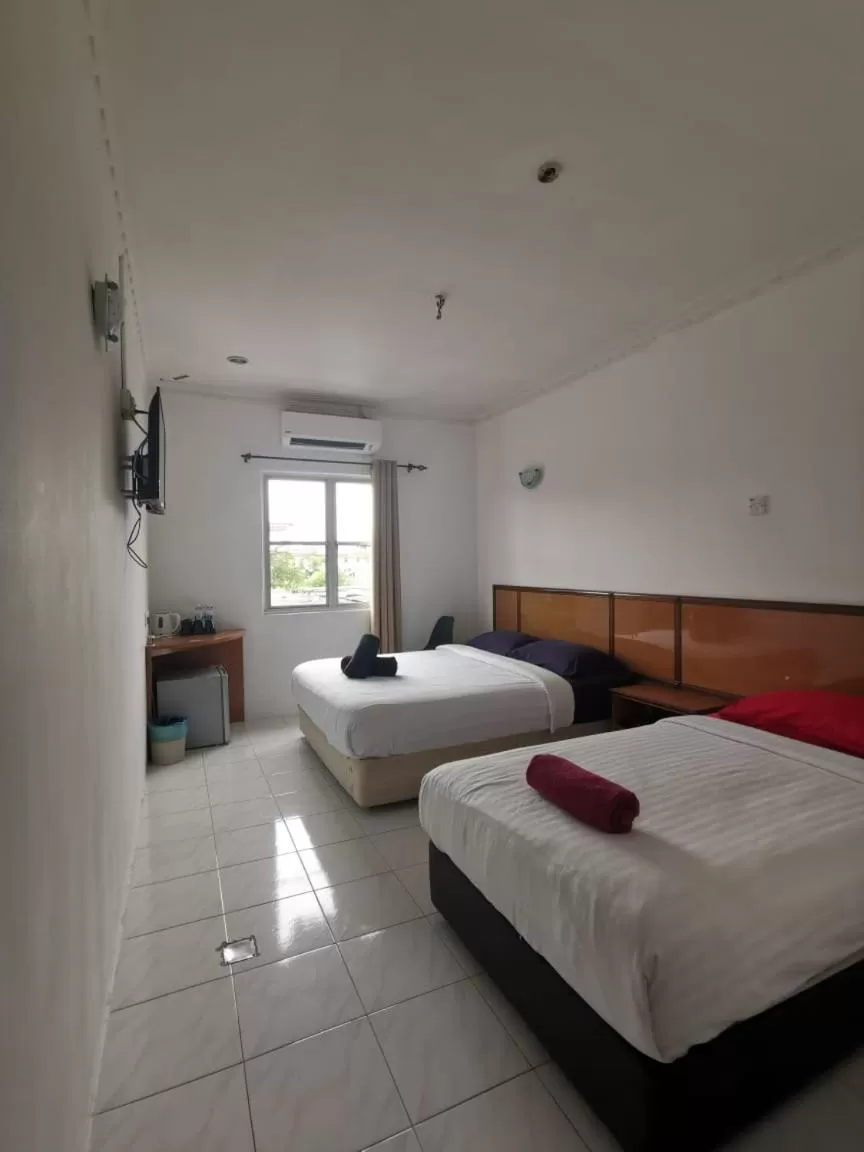 Bed in THE ZULEY HERITAGE HOTEL