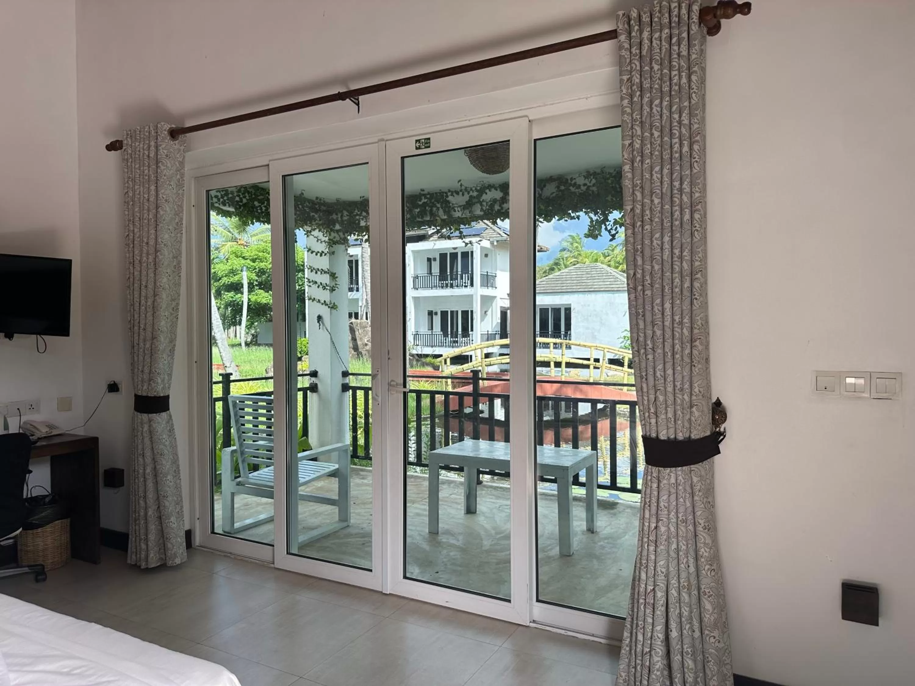 Patio, Bed in Amaluna Resorts