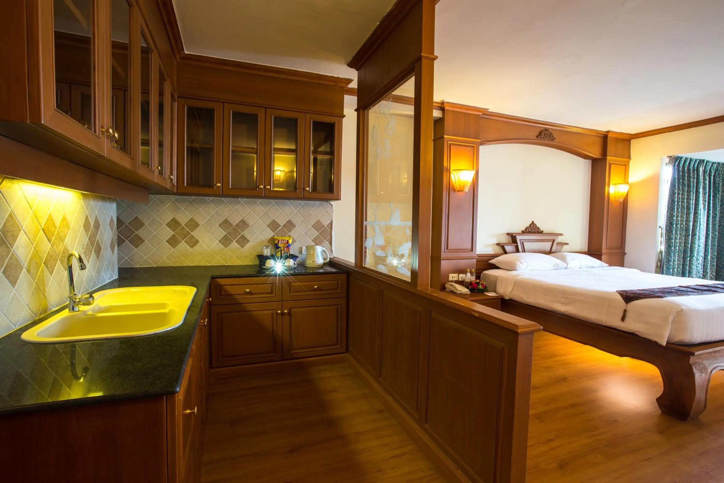 Kitchen or kitchenette, Bed in Furama Chiang Mai