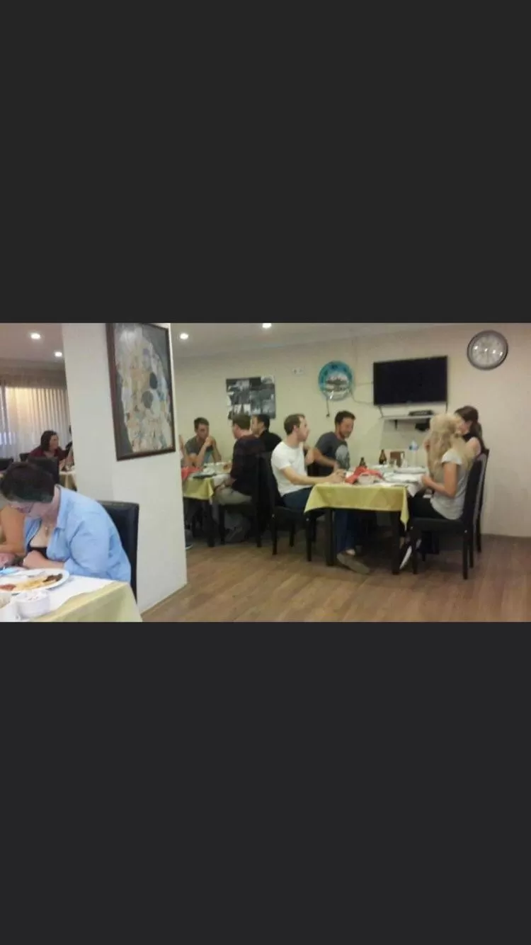 People in Hotel Crowded House