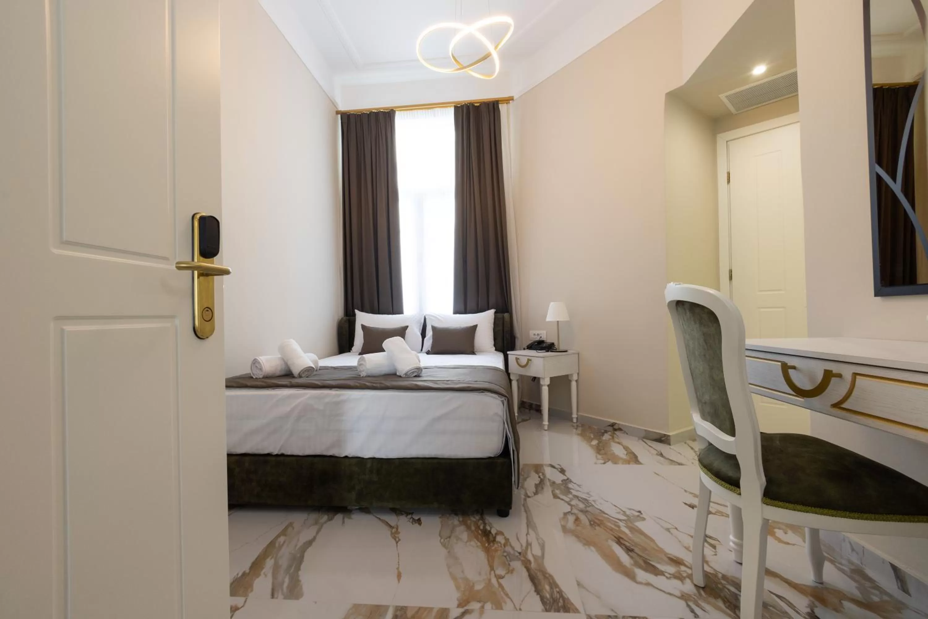 Bed in Modern Revival Luxury Hotel