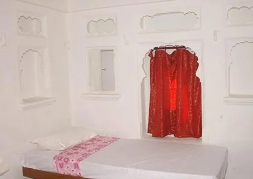 Photo of the whole room, Bed in Udai Haveli Guest House