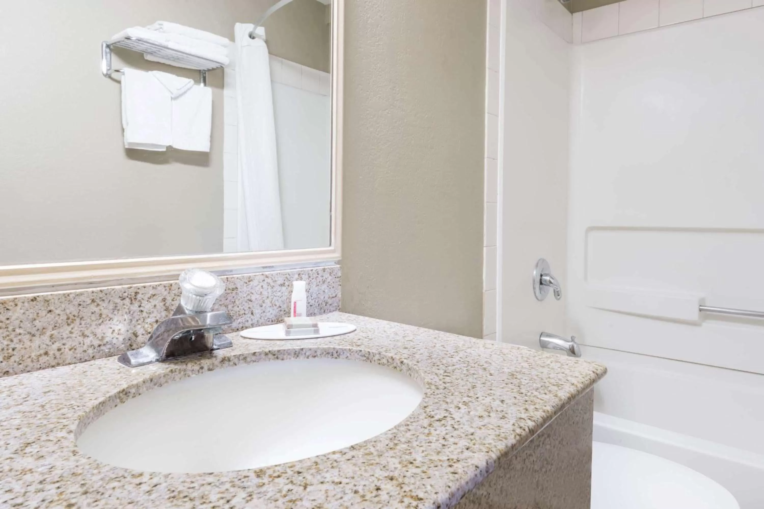 Bathroom in Super 8 by Wyndham Topeka/Wanamaker RD/I-70