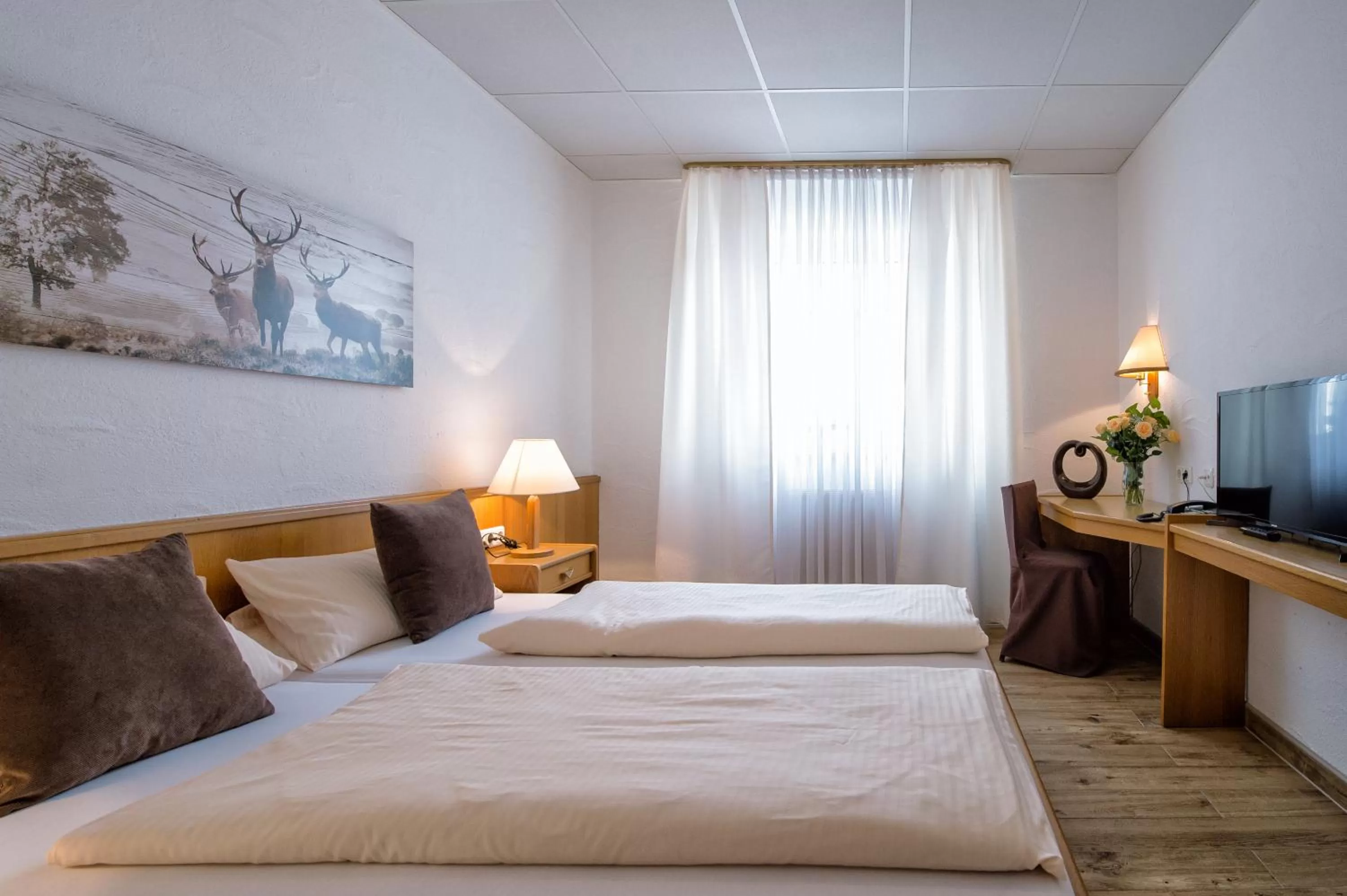 Photo of the whole room, Bed in Hotel-Restaurant Schwyzerhüsli