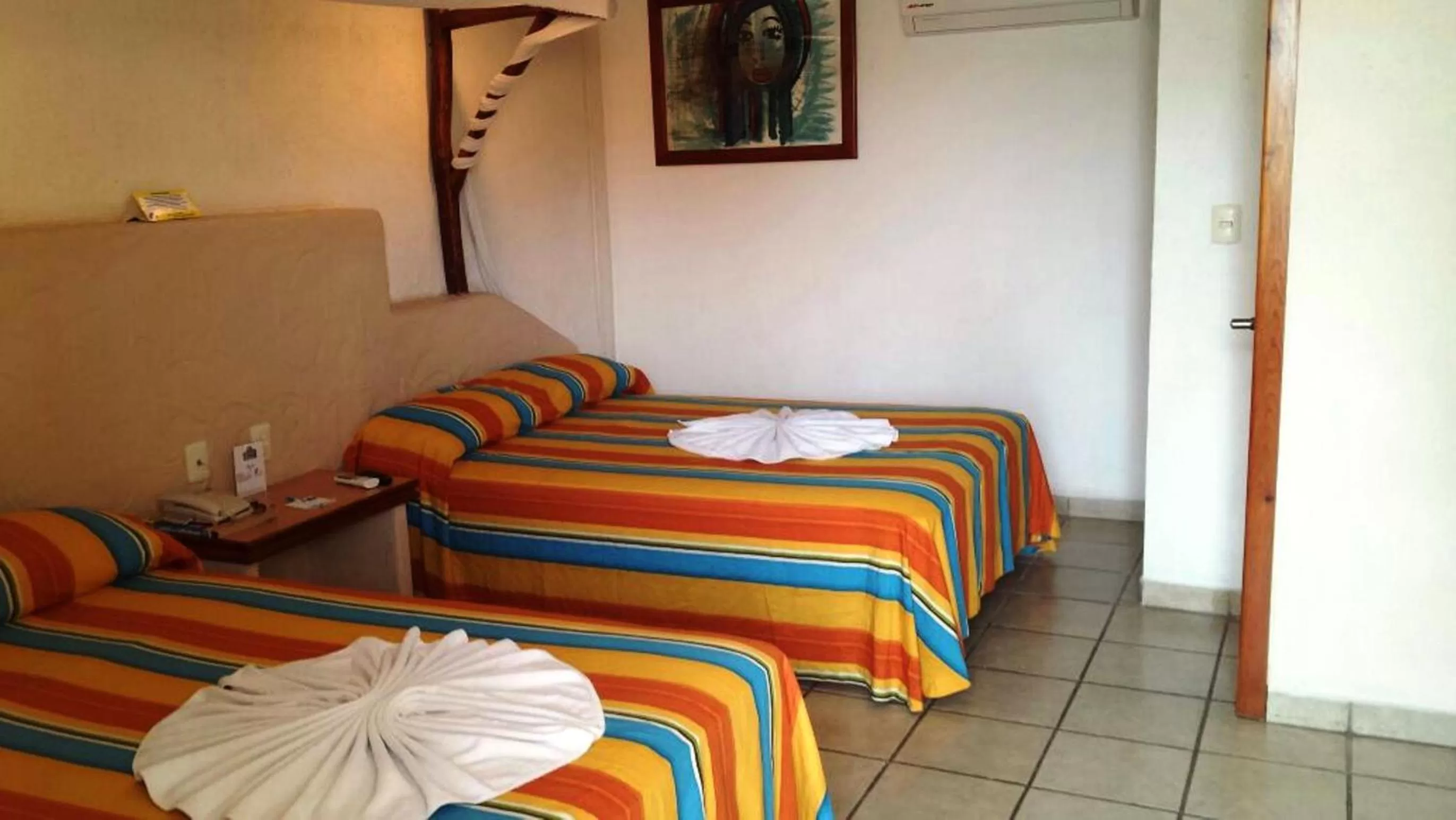 Bed in Hotel Palapa Palace