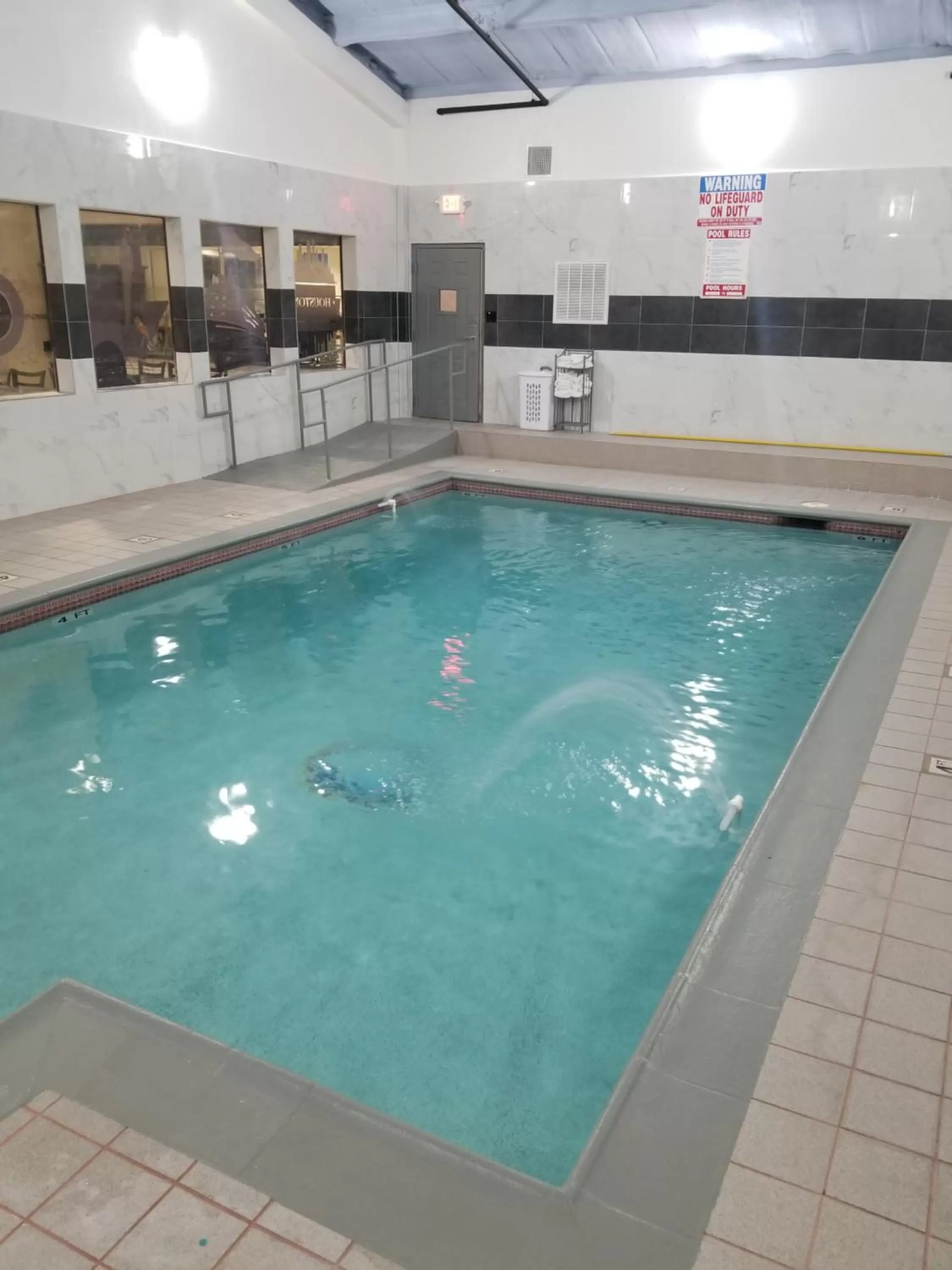 Swimming pool in Days Inn & Suites by Wyndham Webster NASA-ClearLake-Houston