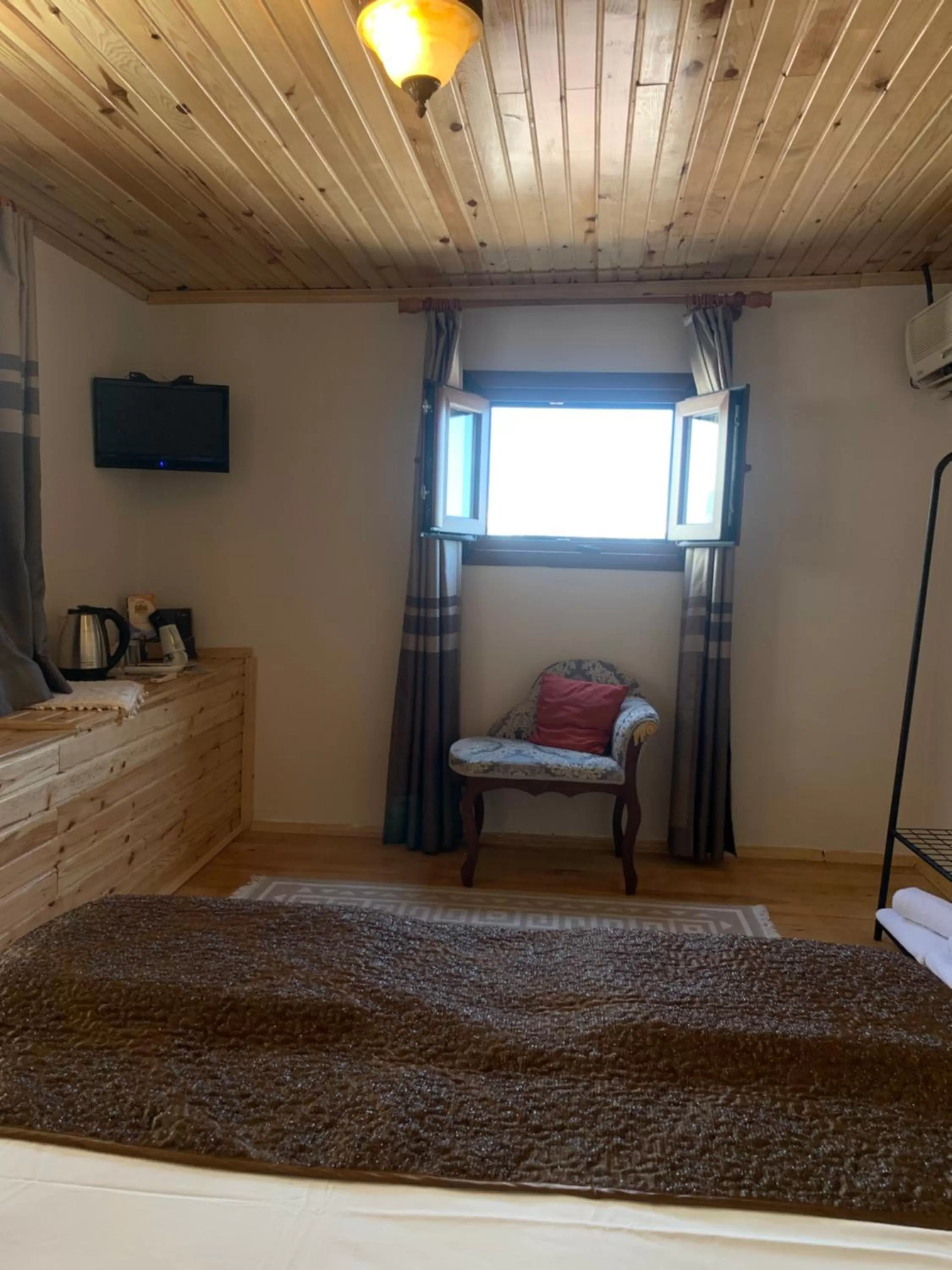 Seating area, Bed in Tom Square Boutique Hotel