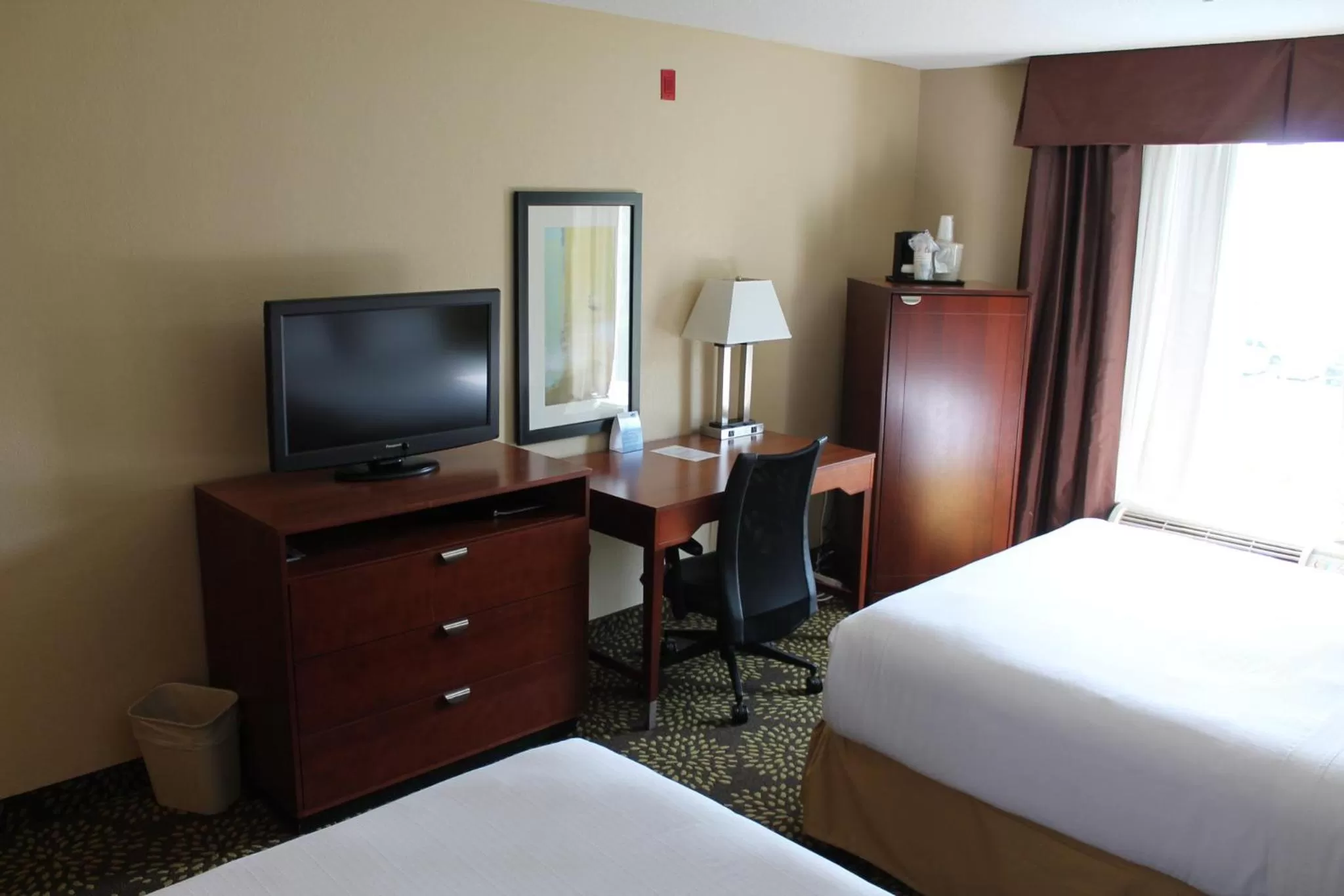 Photo of the whole room, TV/Entertainment Center in Holiday Inn Express Hotel & Suites Starkville, an IHG Hotel