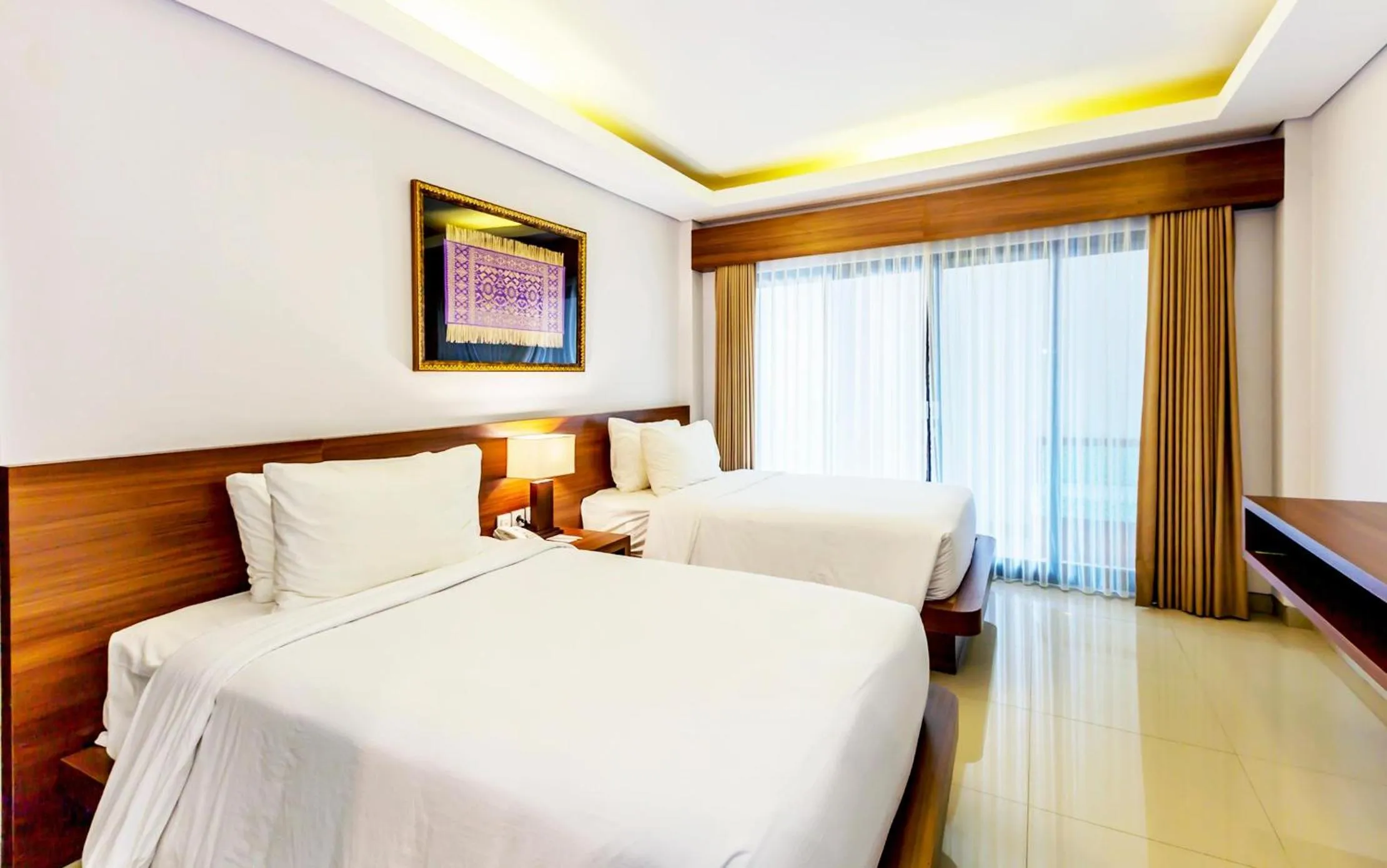 Bed in Grand Mirah Boutique Hotel