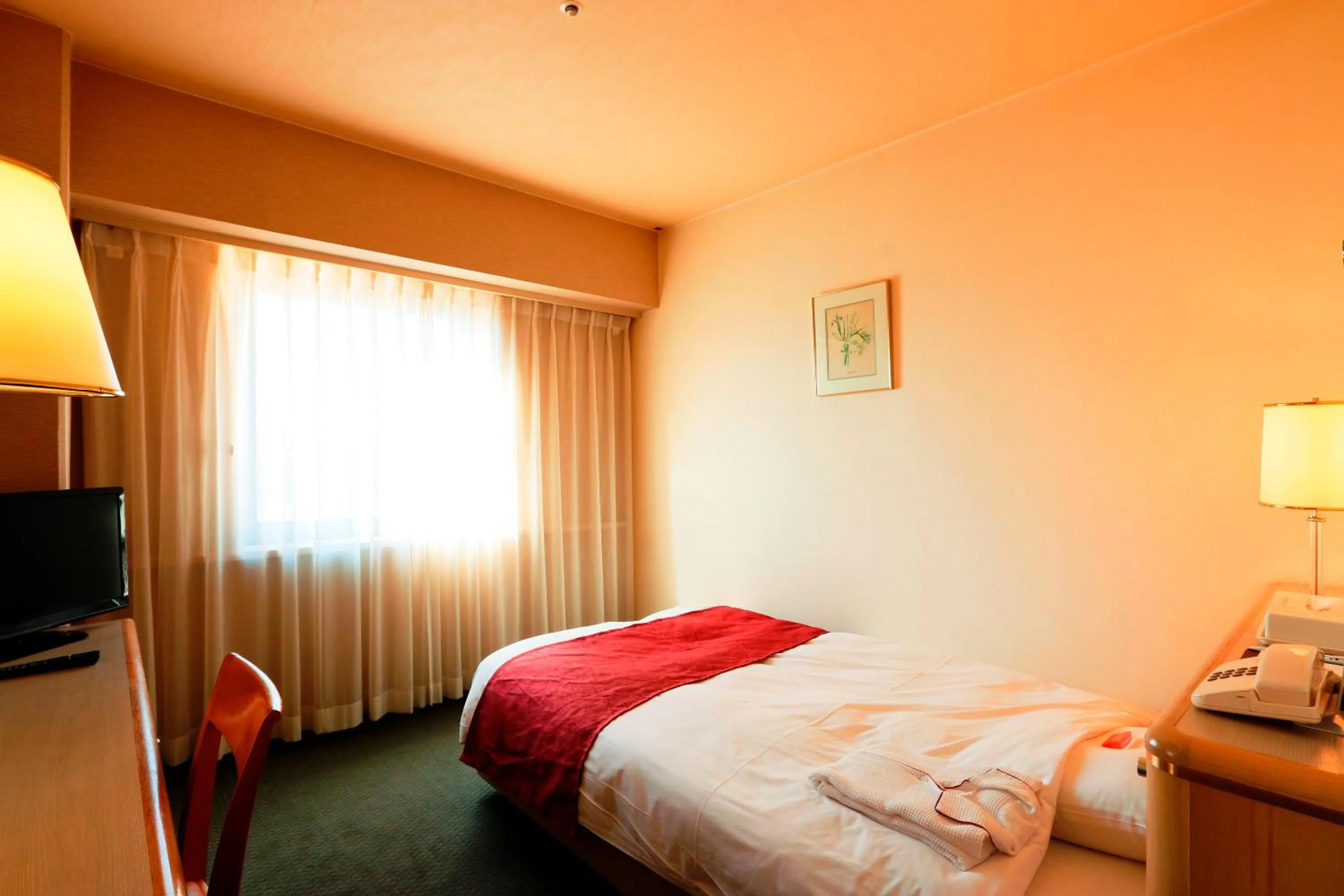 Photo of the whole room, Bed in Nest Hotel Matsuyama