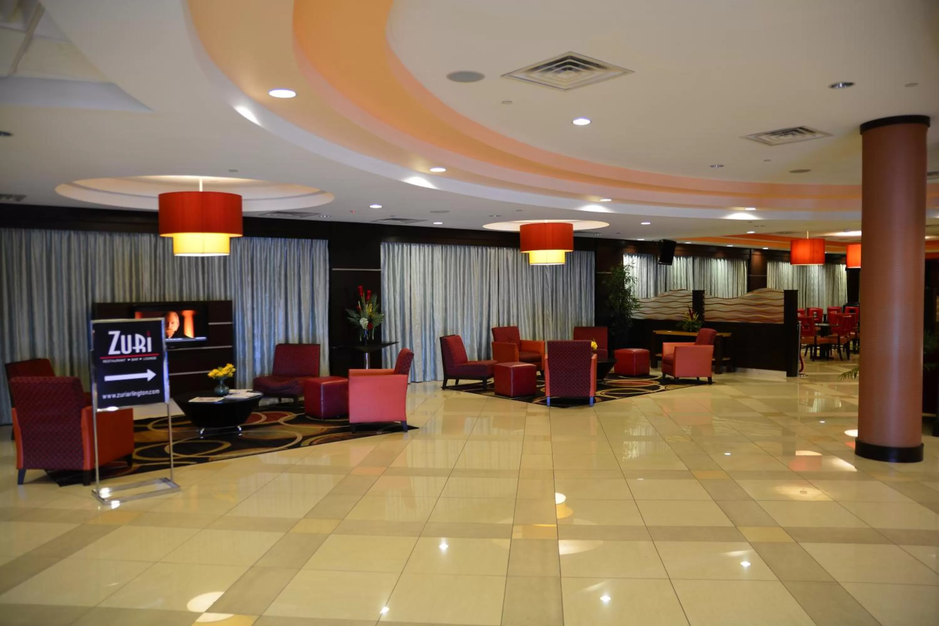 Communal lounge/ TV room in Lux Hotel & Spa, Trademark Collection by Wyndham