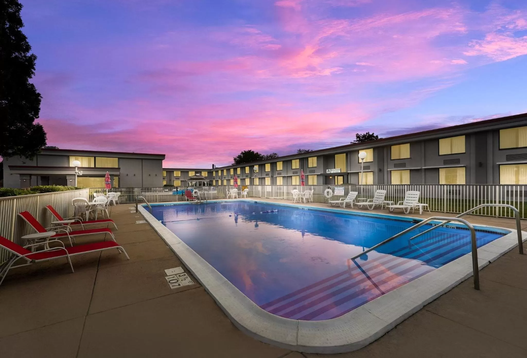 Property building in HomeTowne Studios by Red Roof Painted Post