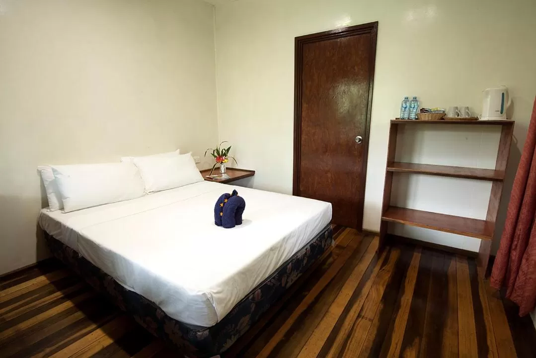 Bed in Tawali Leisure & Dive Resort