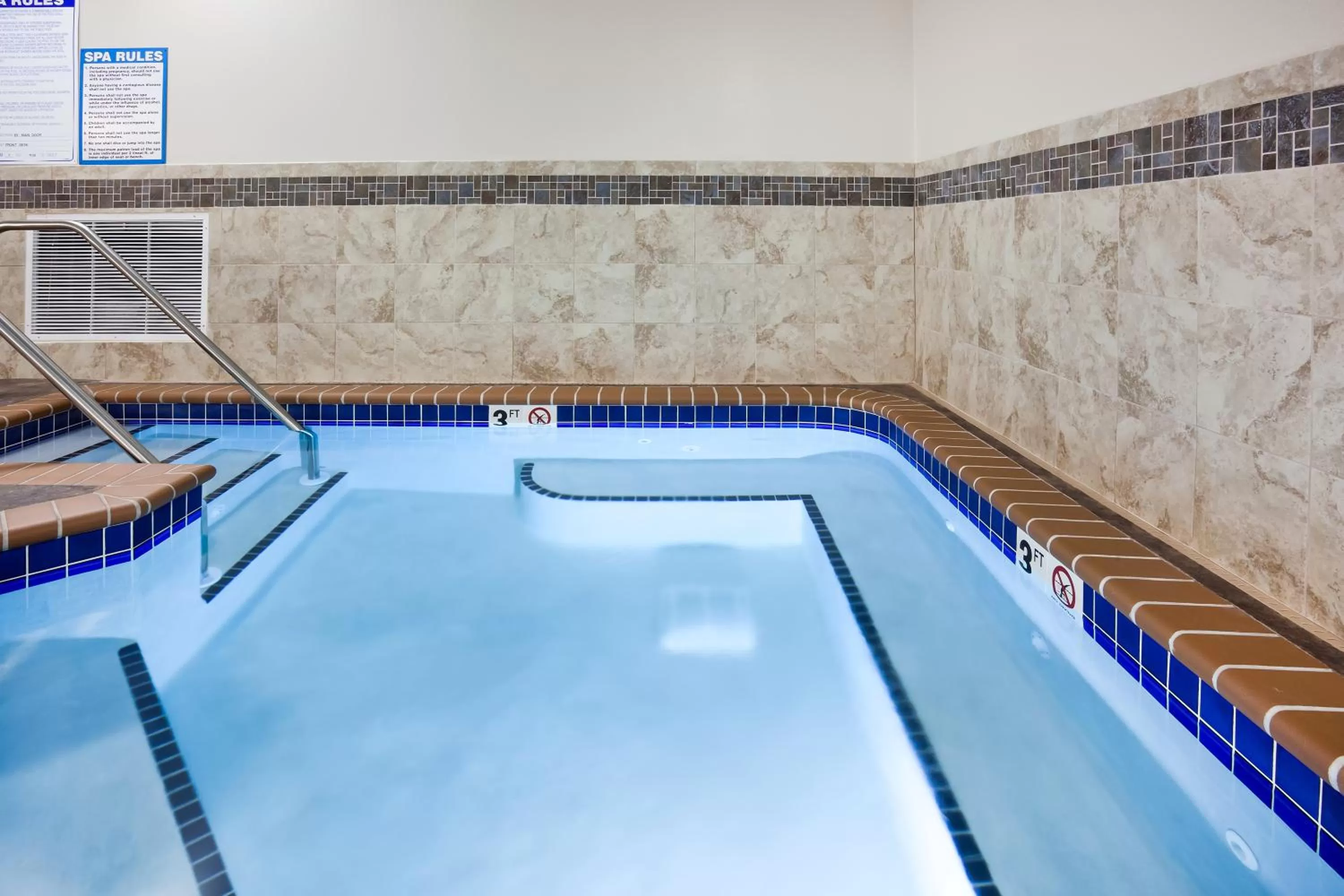 Swimming pool in AmericInn by Wyndham DeWitt