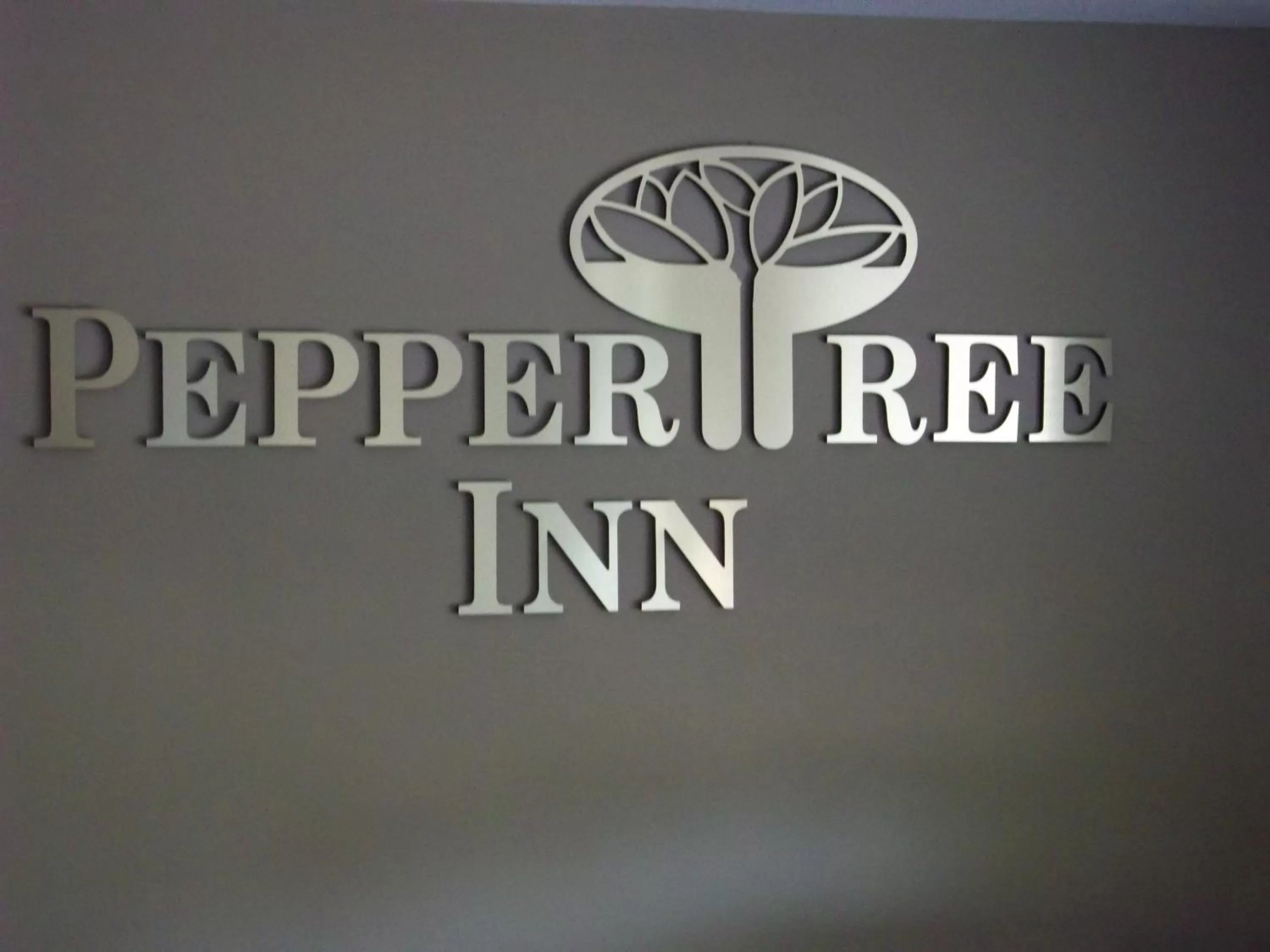 Property logo or sign in Pepper Tree Inn