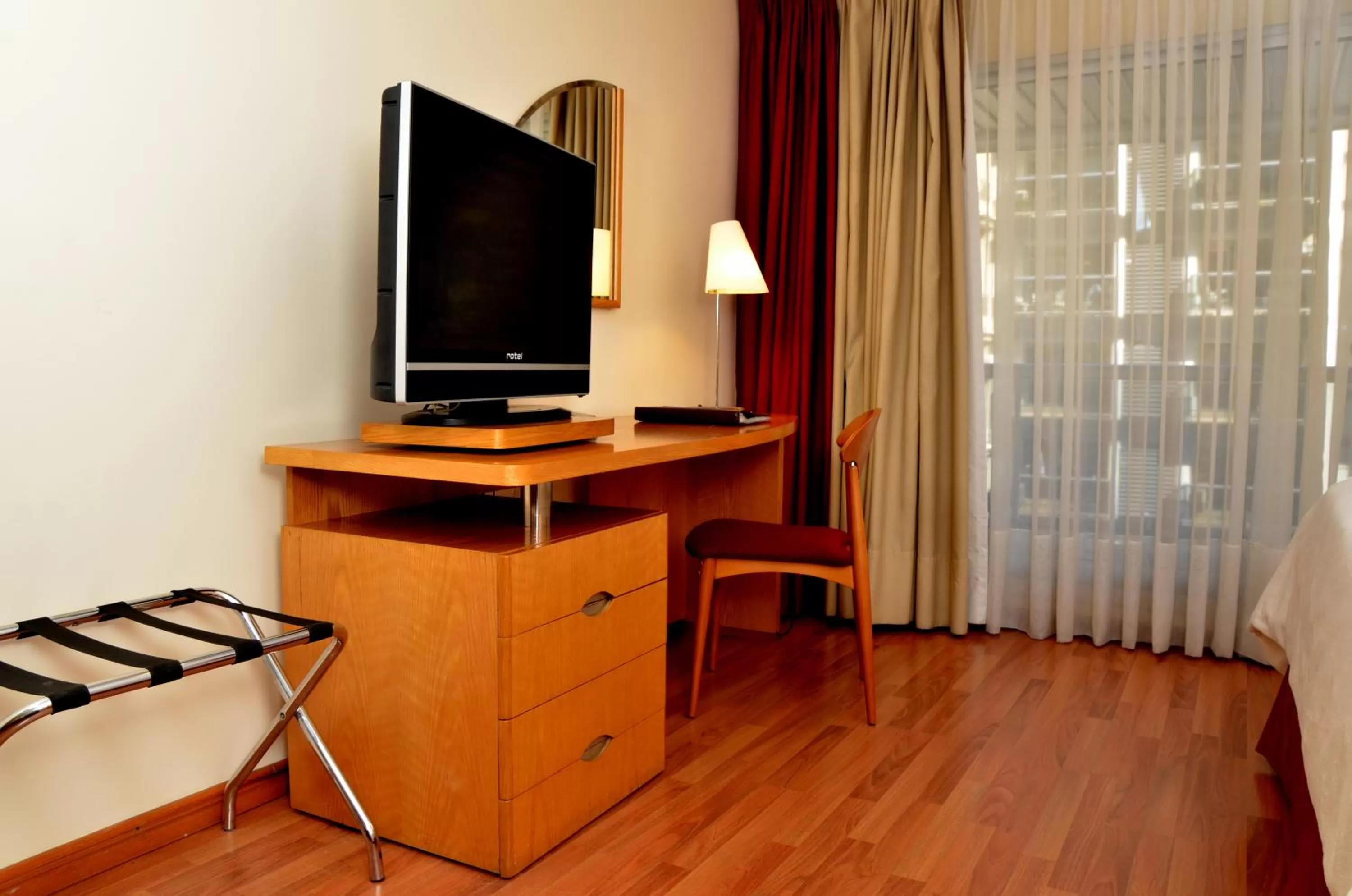 TV and multimedia, TV/Entertainment Center in Armon Suites Hotel