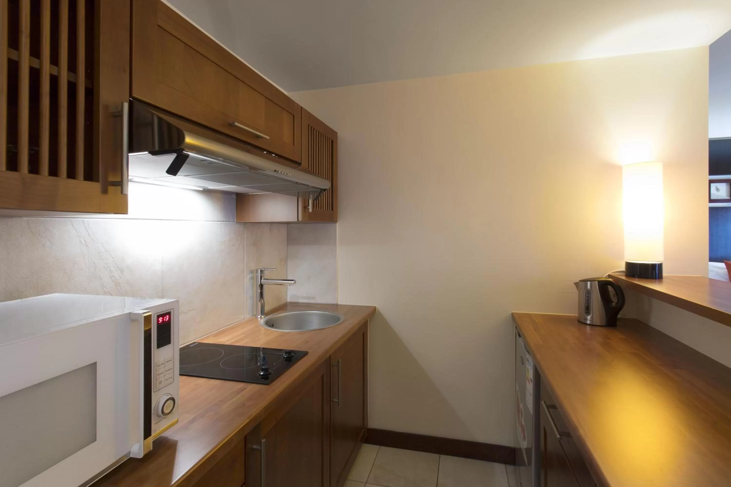 Kitchen or kitchenette in Ramada Hotel & Suites by Wyndham Noumea