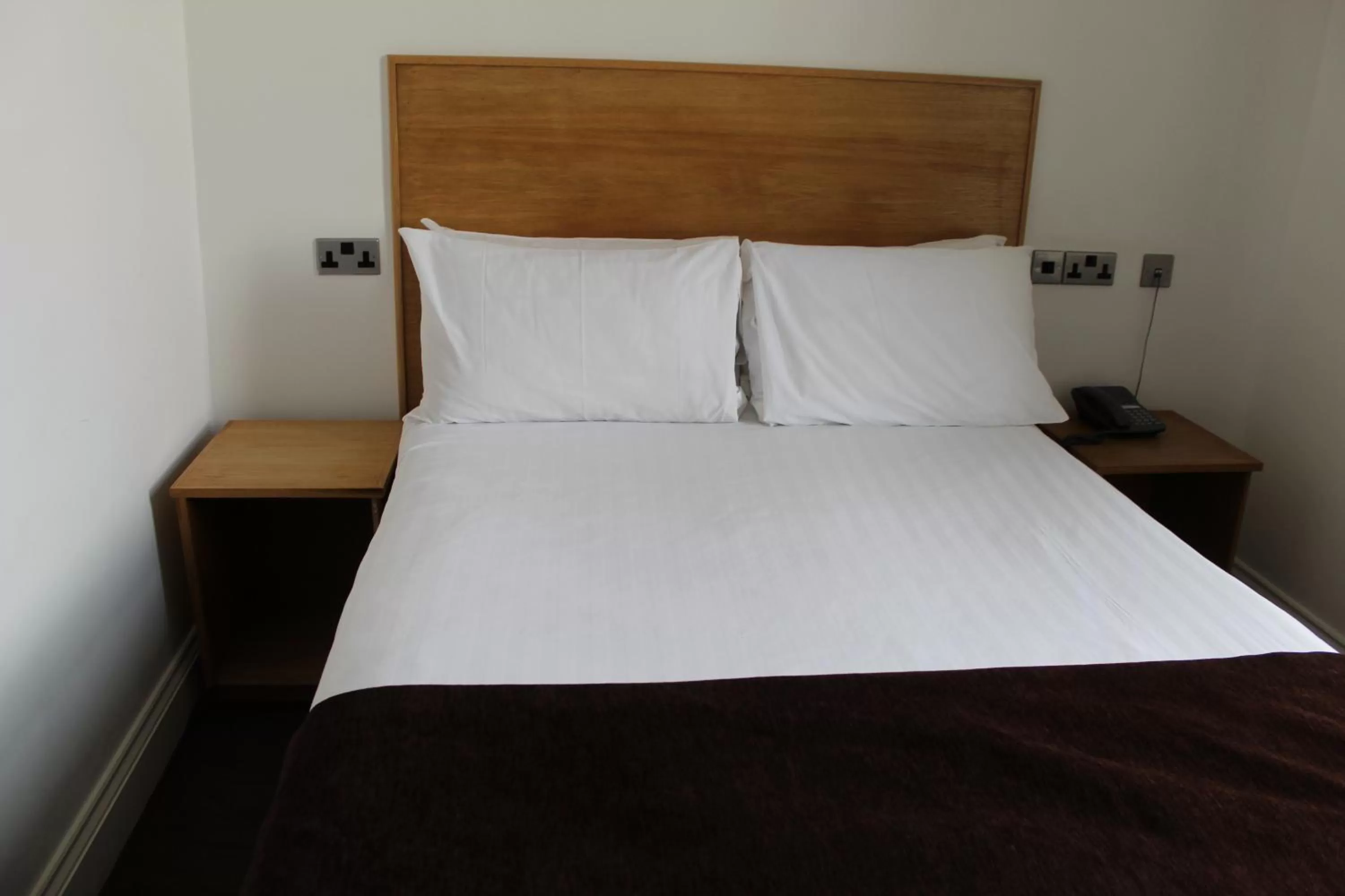 Bed in Four Saints Brig Y Don Hotel