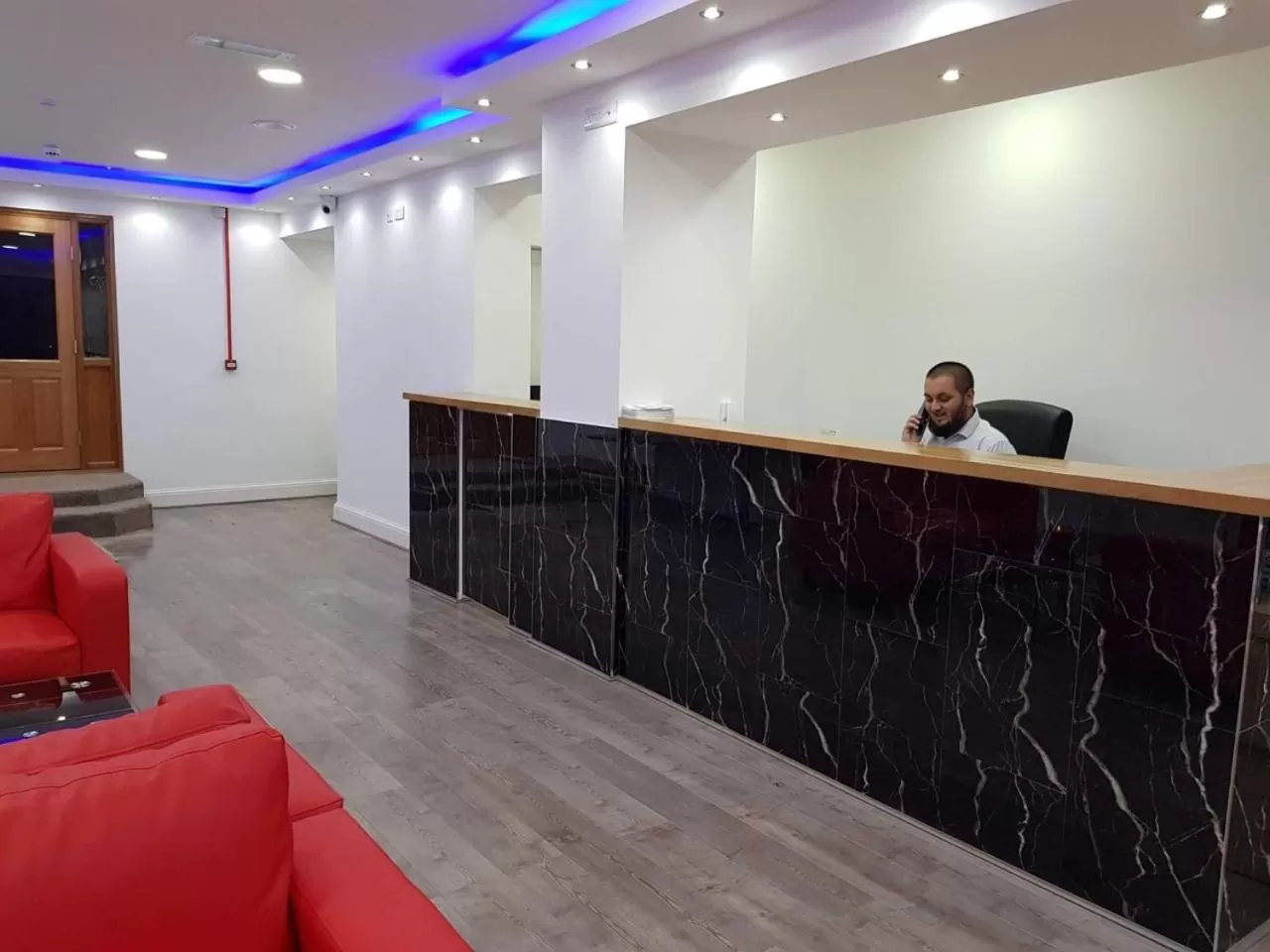 Communal lounge/ TV room in The Charles Hotel