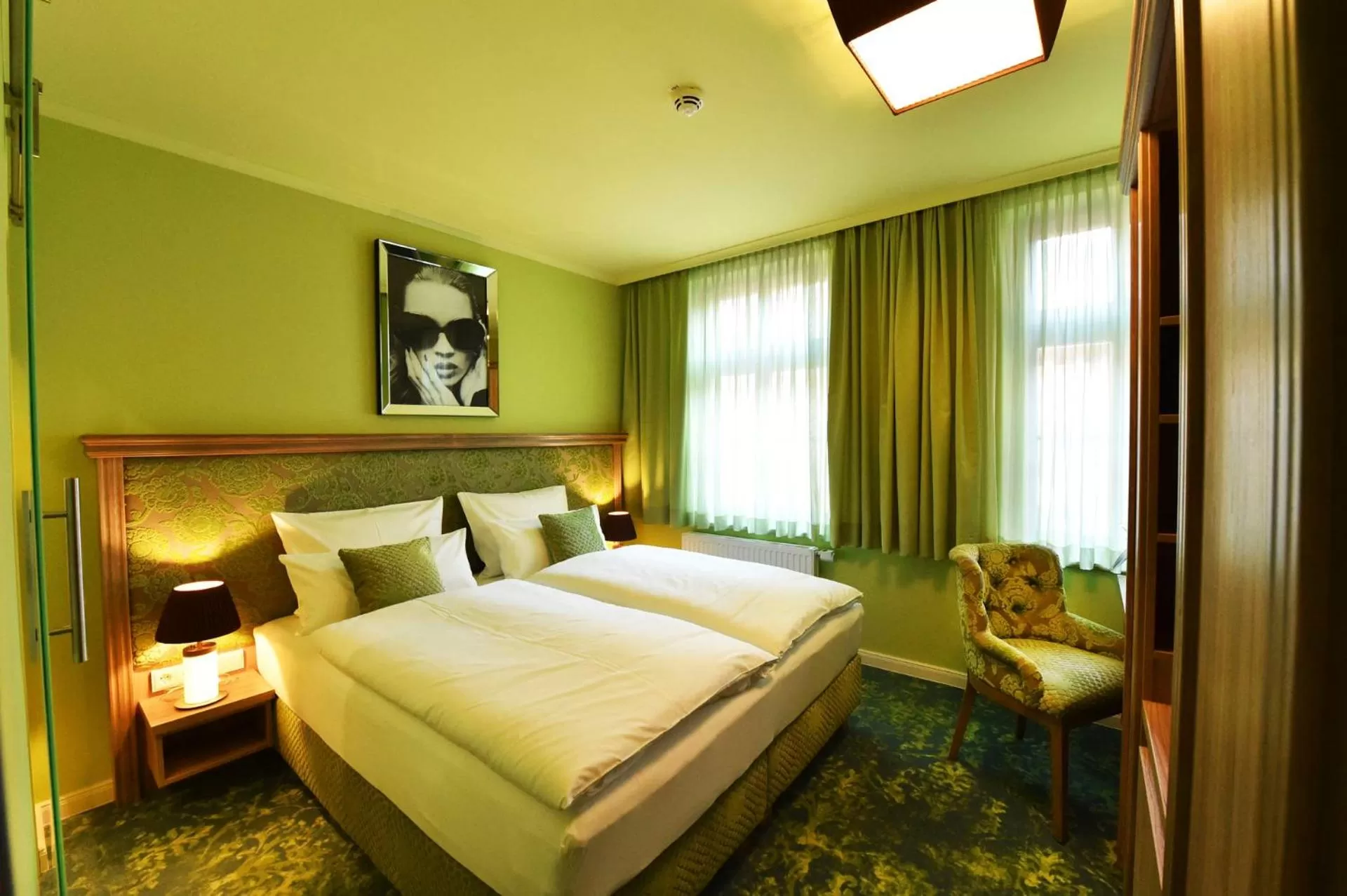 Photo of the whole room, Bed in MOMENTS Boutique Hotel