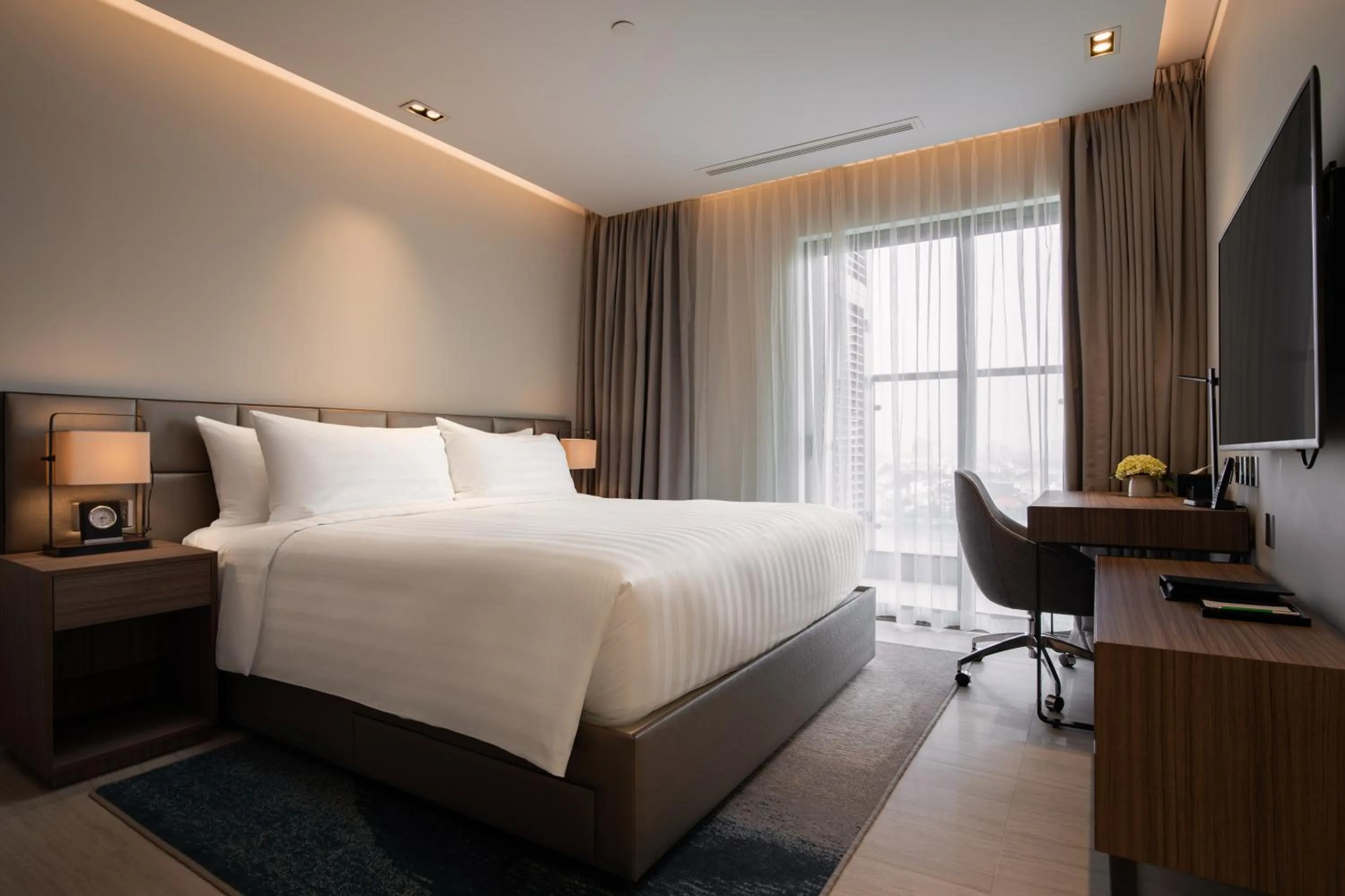 Bed in Oakwood Residence Hanoi