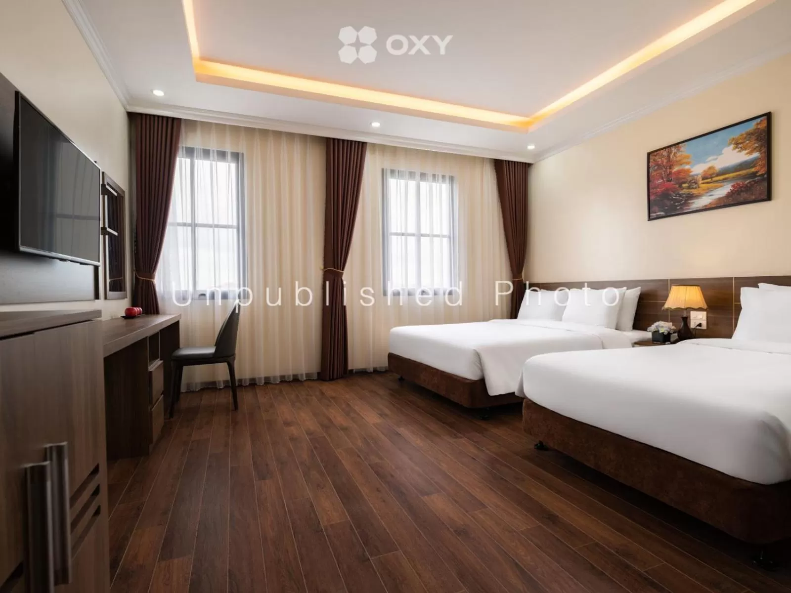 Communal lounge/ TV room, Bed in Ha Long Essence Classic Hotel