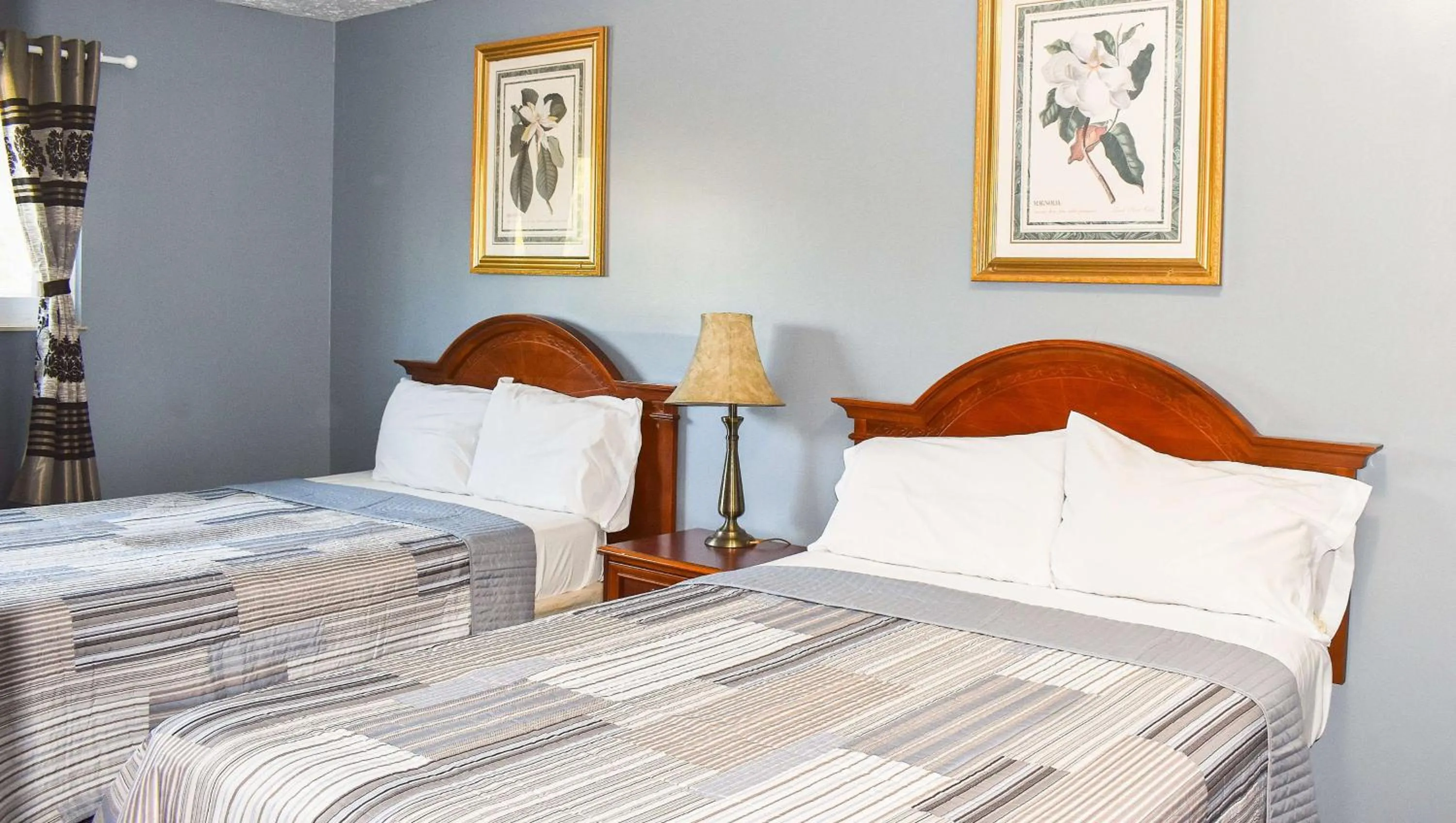 Photo of the whole room, Bed in Magnuson Hotel Extended Stay Canton Ohio