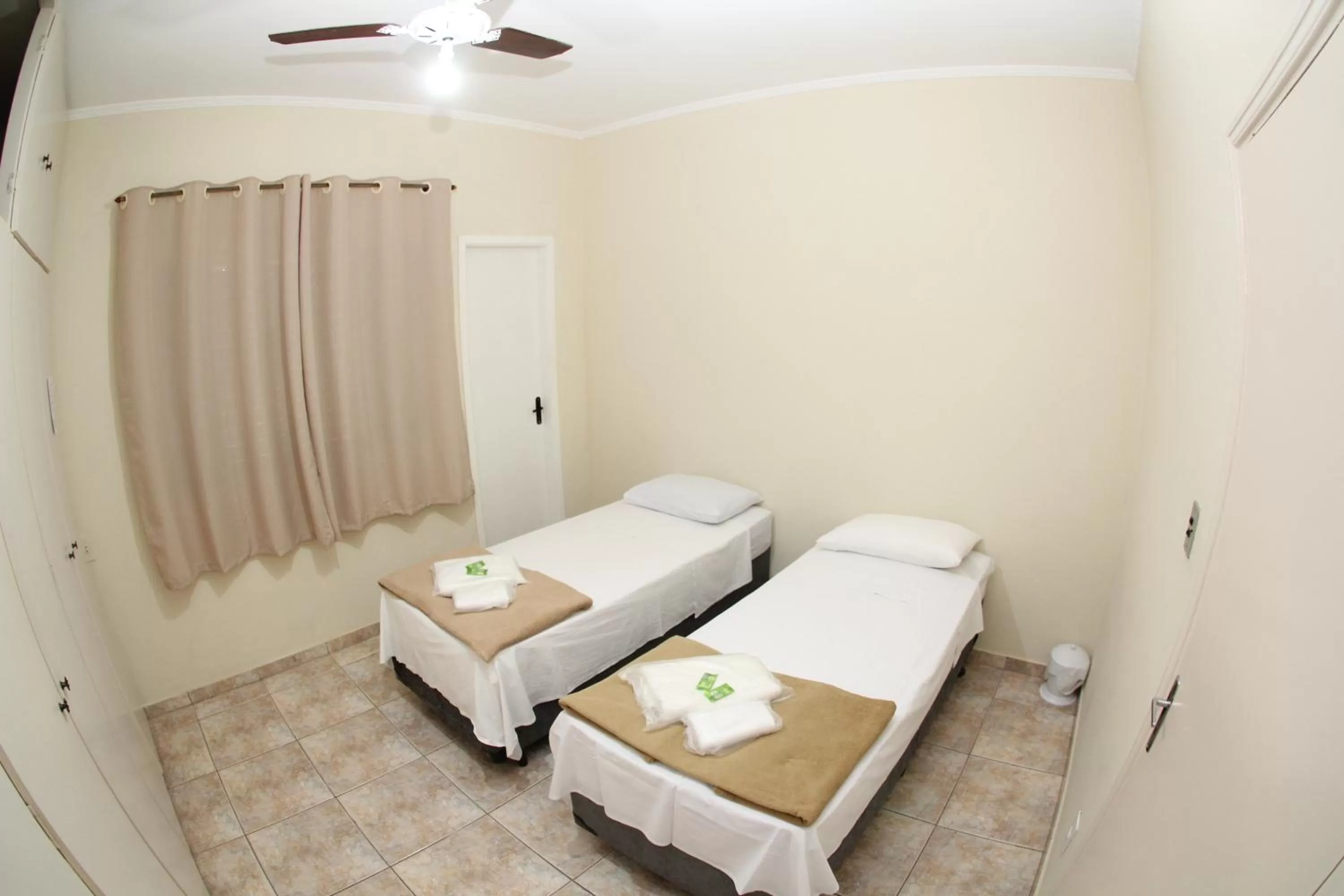 Bed in Pousada Santa Genebra